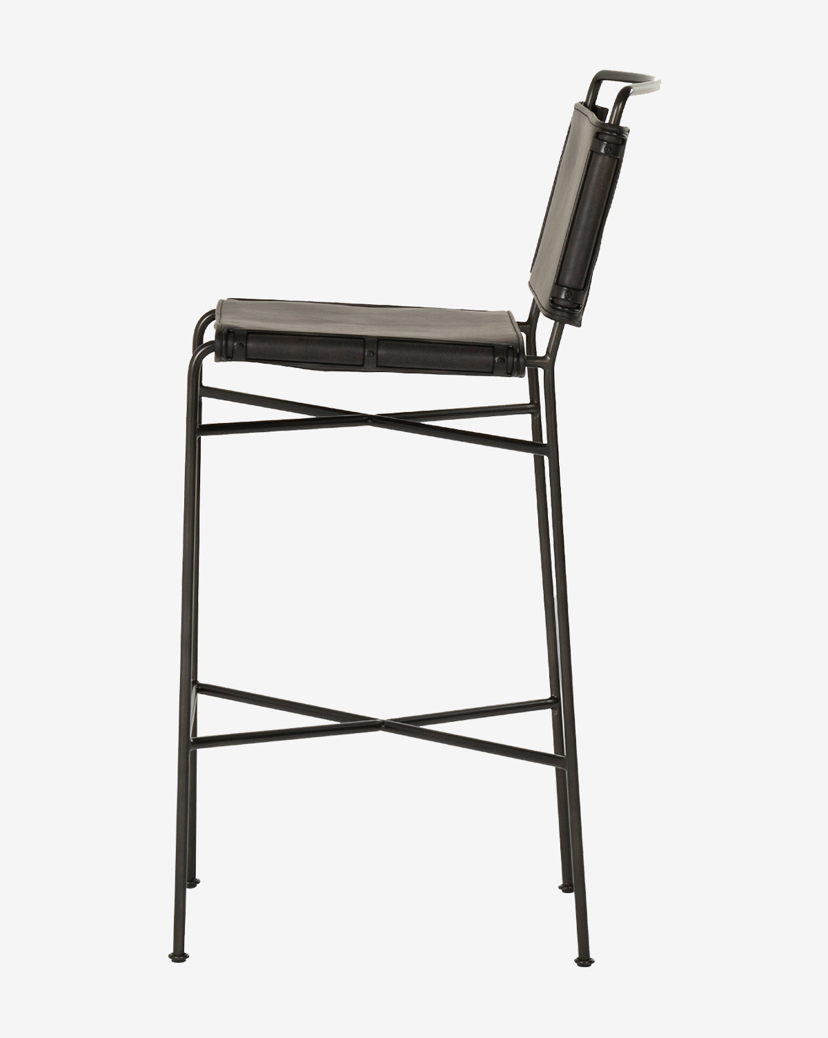 The Moore Stool features a modern black metal frame, slender design, and matching leather seat and backrest, adding industrial style to any space. Shown in side view against a plain white background by McGee & Co.