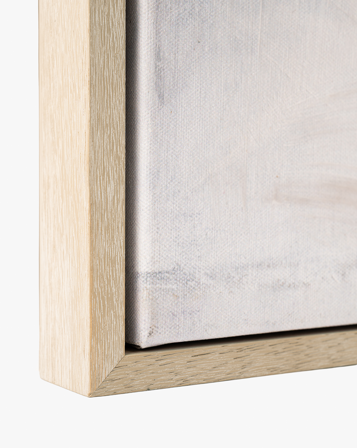 Close-up of the corner of a light-finished wooden frame and textured canvas—ideal for serene home decor or displaying abstract wall art like "Moving Fog by Judy Cox by Vendixs