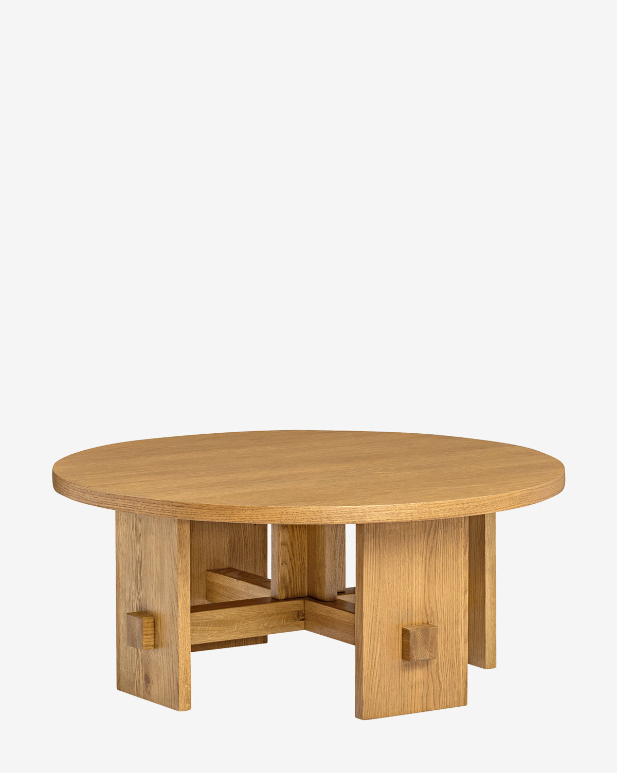 The Newbold Coffee Table features a round oak top with a natural honey finish and a sturdy geometric base of four thick legs with cross-bracing, set against a plain white background, by Vendixs