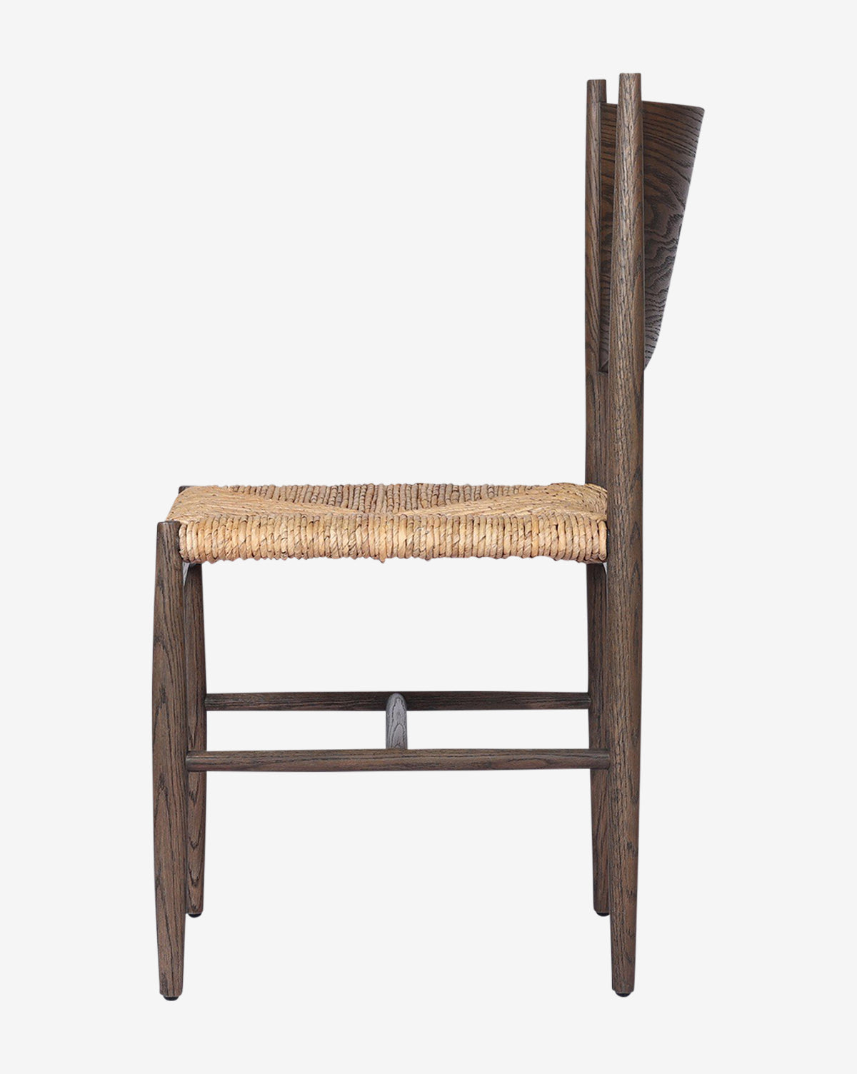 Side view of the Nixie Dining Chair, crafted from solid oak with a woven straw seat and a straight, tall backrest. Features a minimalist rustic design and is shown against a plain white background, by Vendixs