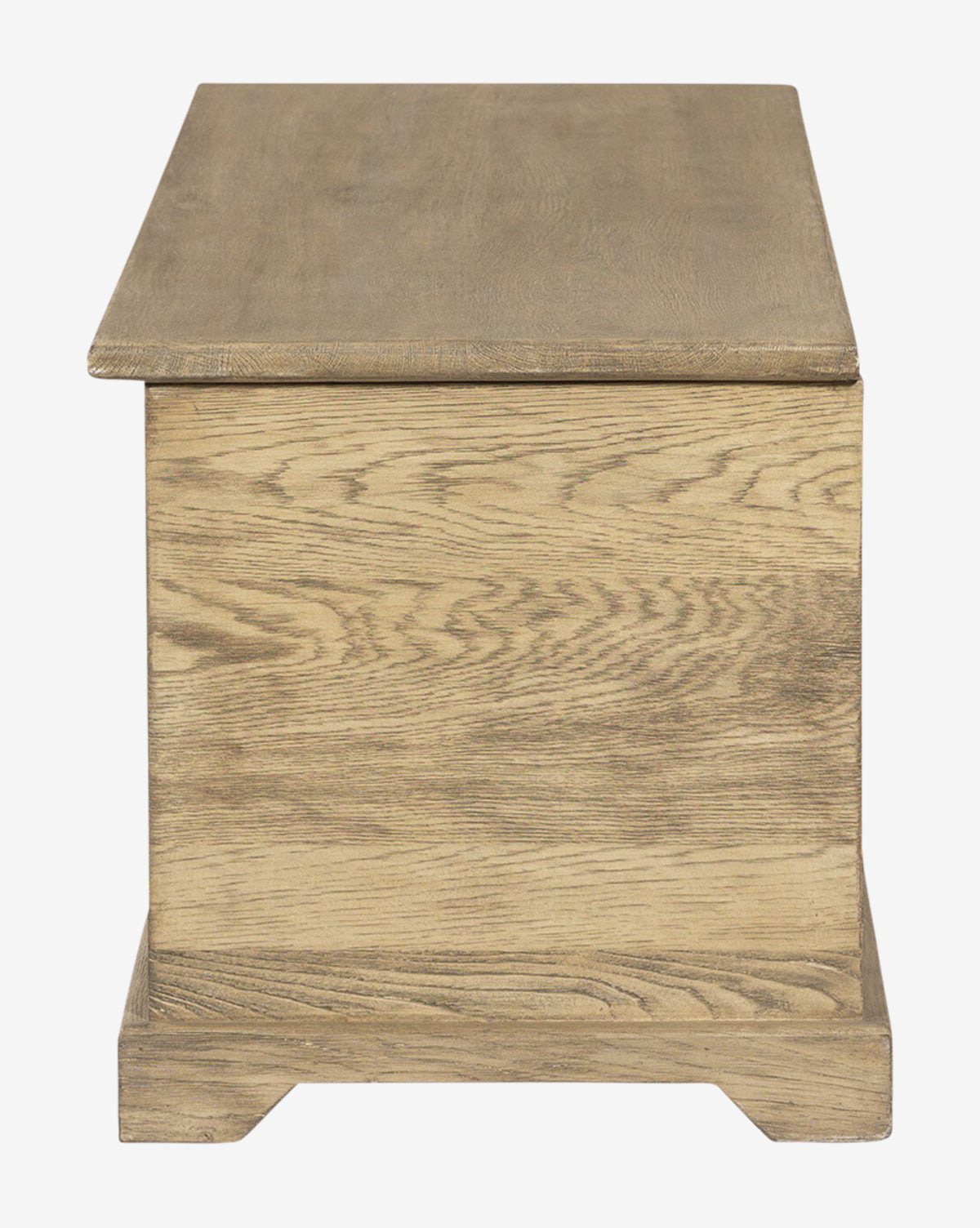 The Norman Bench by Four Hands features a rectangular wooden design with a flat lid, light brown finish, and visible wood grain, combining timeless style with practical storage—blending seamlessly with the curated look of Vendixs