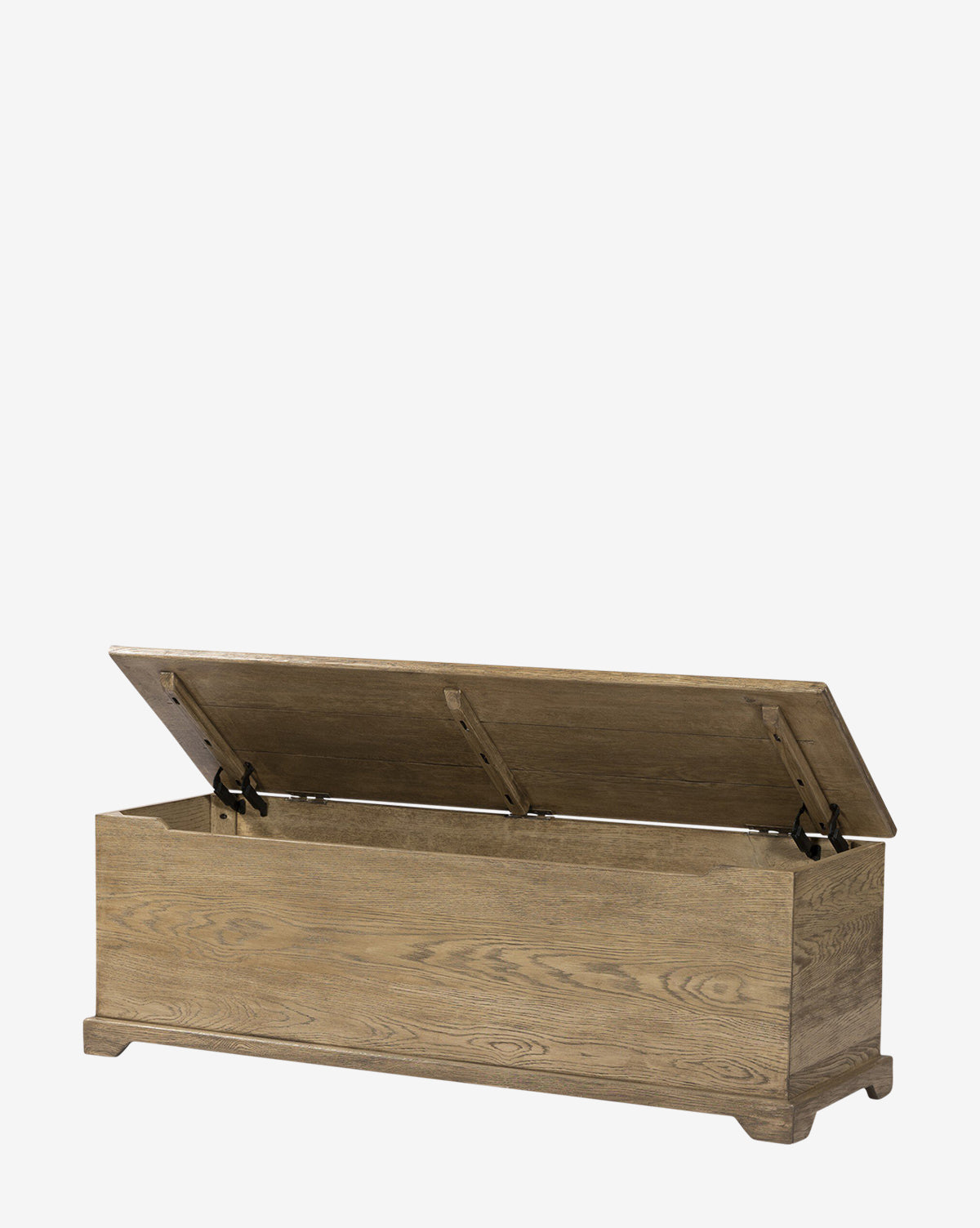 The Norman Bench by Four Hands is a solid oak bench with a hinged lid thats partially open to reveal built-in storage. Featuring a natural wood grain finish, its simple rectangular design and short legs make it ideal as an entryway bench, blending seamlessly with pieces from Vendixs