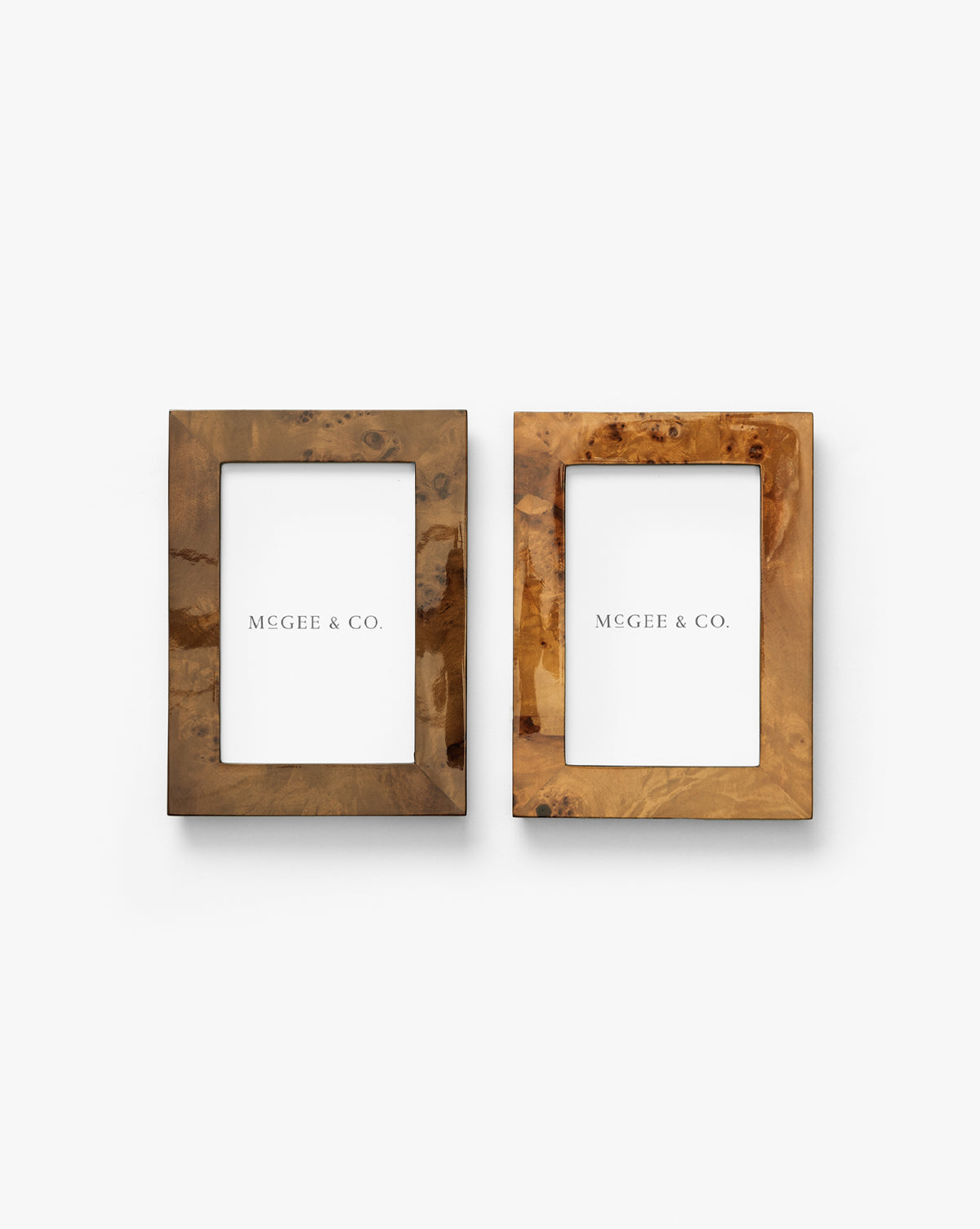 The Oliver Burl 4x6 Frames (Set of 2) feature a natural brown wood grain finish and come with Vendixs placeholders, making elegant additions to your home decor, by Vendixs Shown side by side on a white background.