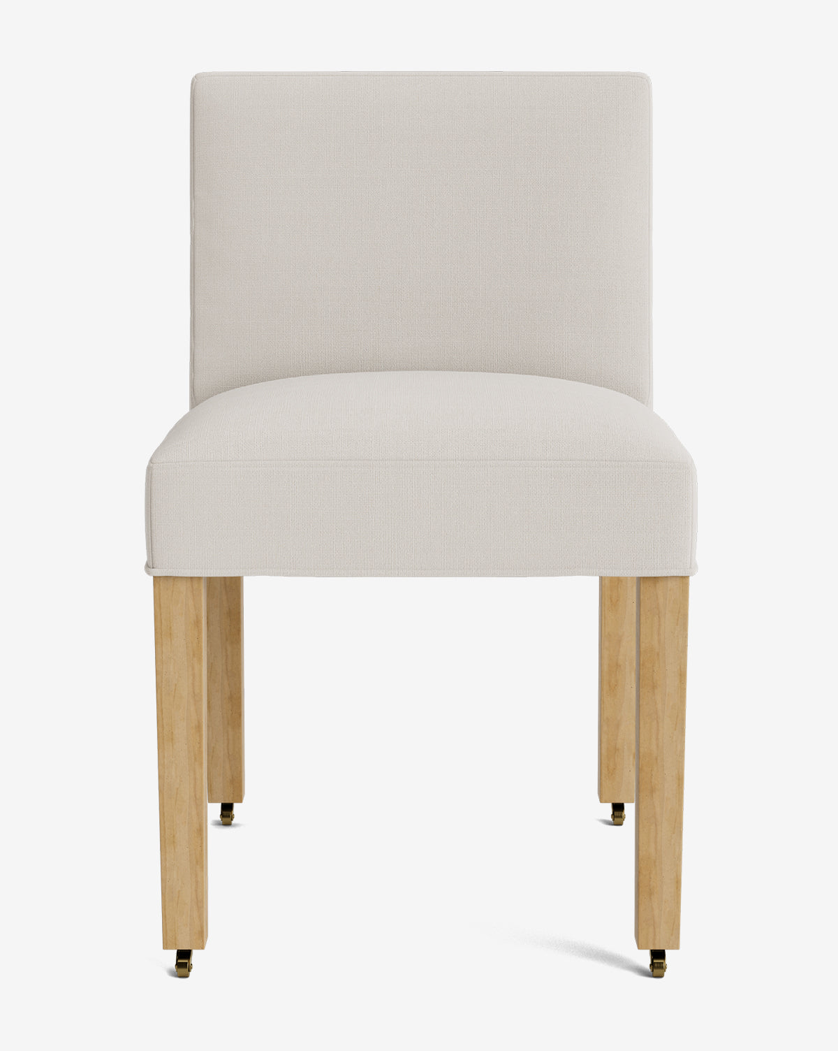 The Olivier Upholstered Dining Chair by Rowe Fine Furniture, Inc. features a modern design with a cushioned white fabric seat and backrest, four light wood legs, and brass casters on each leg, all set against a plain white background. Vendixs
