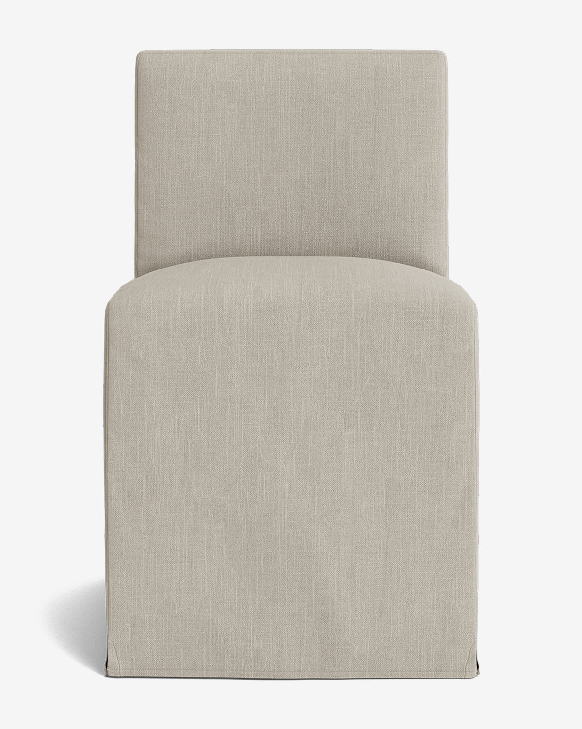The Olivier Slipcover Dining Chair features a tall, rectangular back, armless design, skirted base, and light beige upholstery, shown against a white background by McGee & Co.