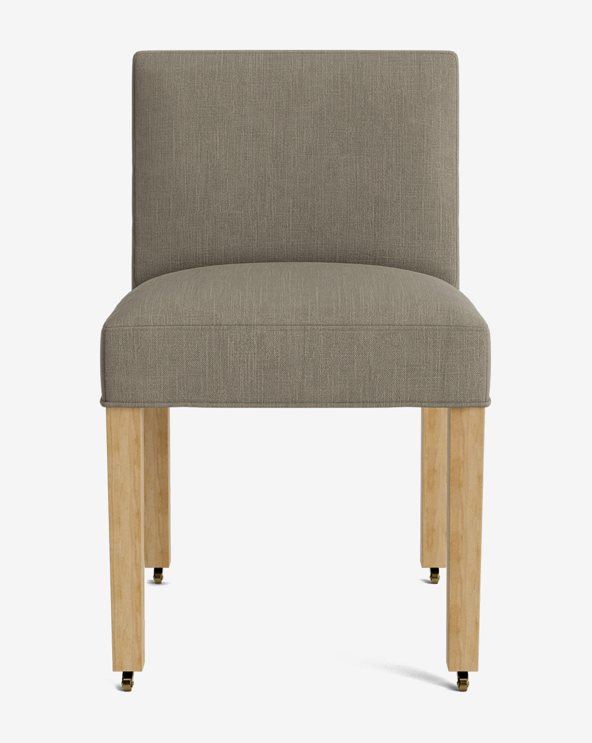 The Olivier Upholstered Dining Chair features a light brown feather and down blend seat and backrest, set on four light wood legs with black and brass casters, shown against a plain white background by Vendixs