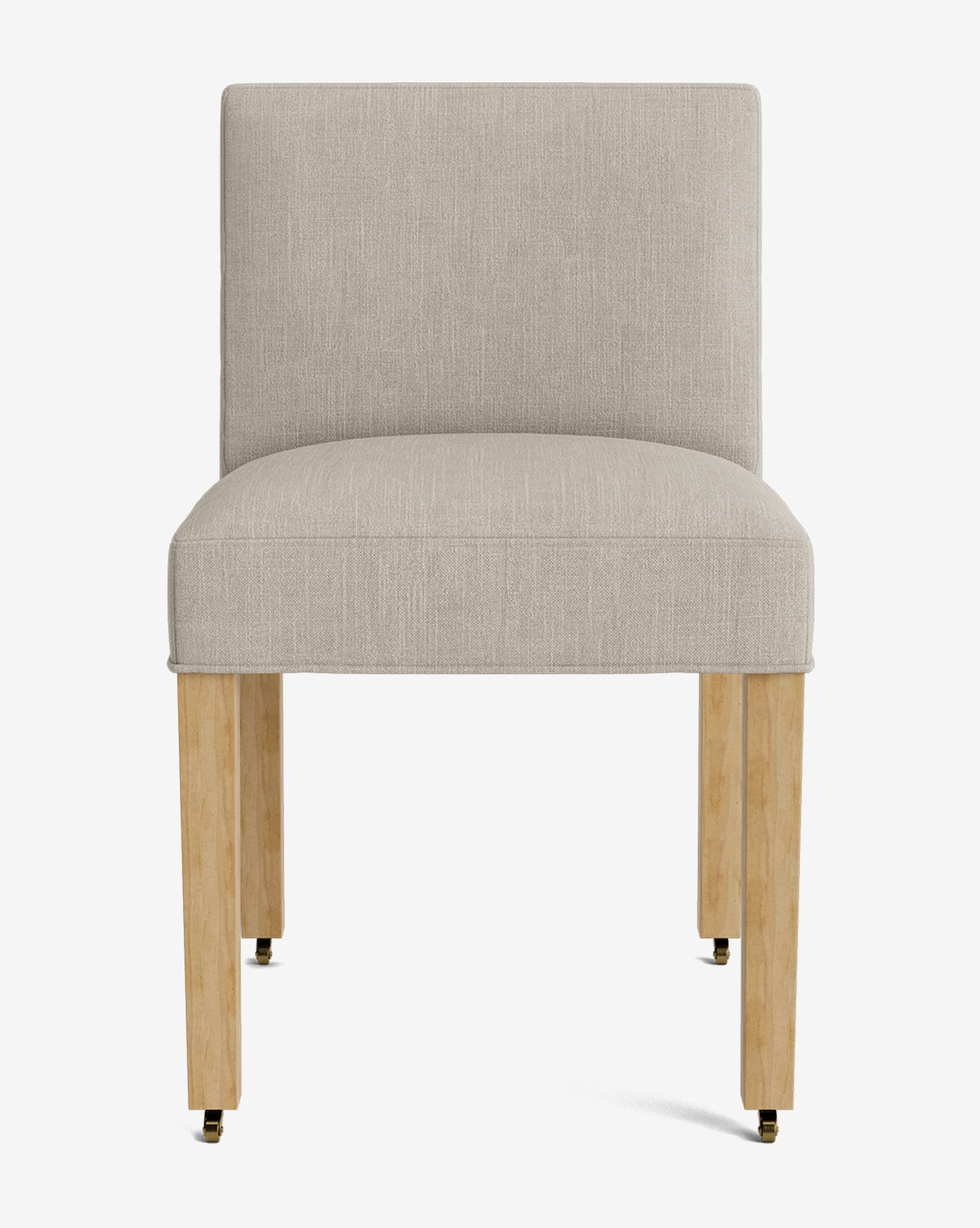 The Olivier Upholstered Dining Chair features a modern armless design, high-quality light beige fabric, straight backrest, wooden legs, and front brass casters, all set against a plain white background by Vendixs