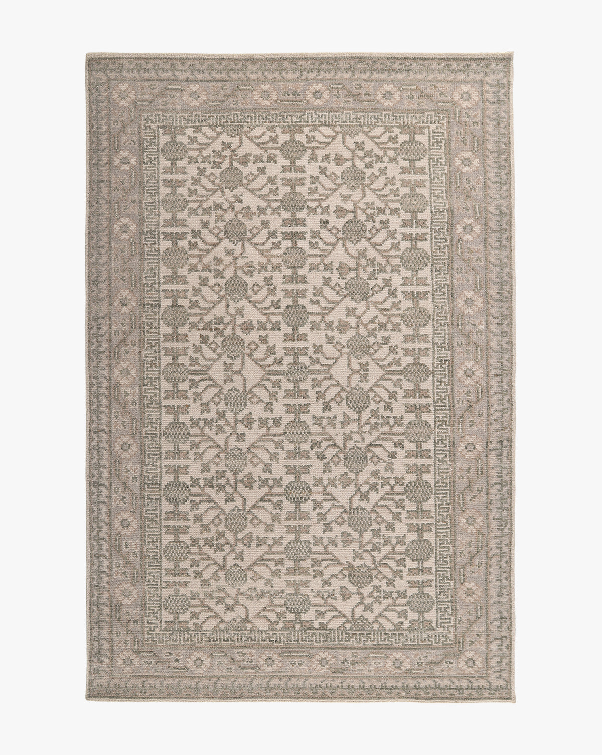 The Orsino Hand-Knotted Rug is a rectangular piece with an intricate, symmetrical floral and geometric pattern in neutral beige, gray, and taupe shades, finished with a detailed border framing the central design by Vendixs