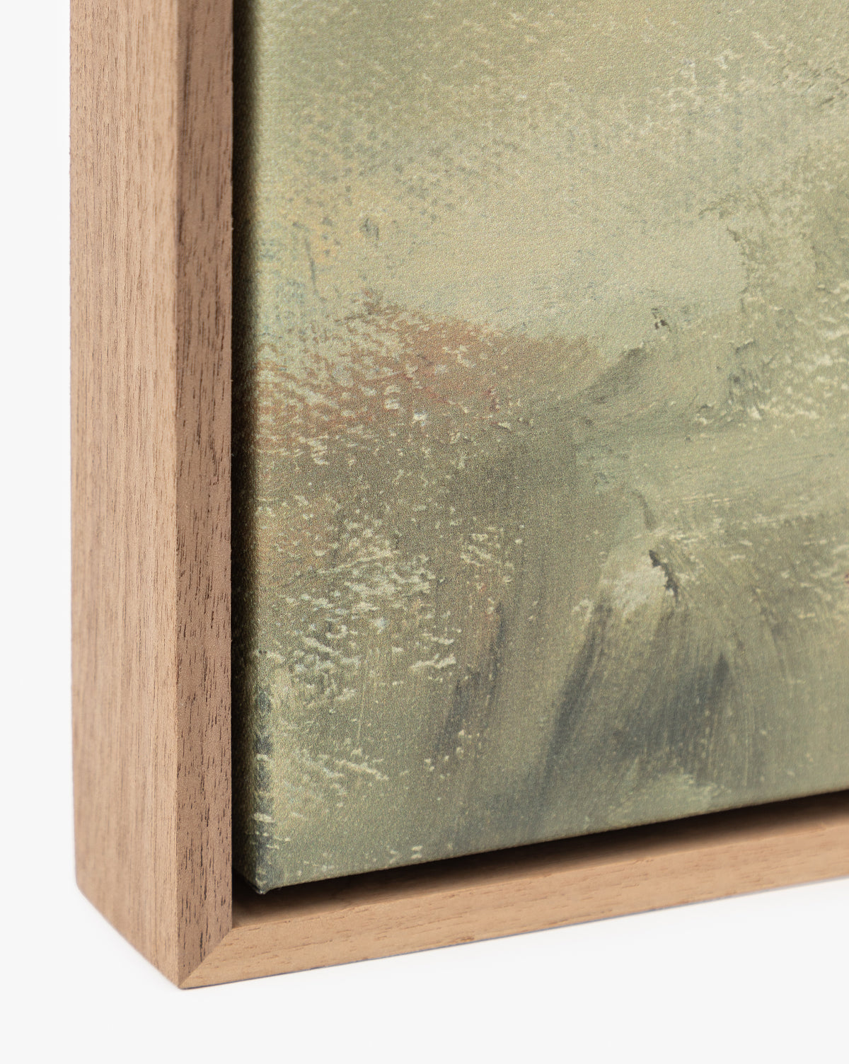 Close-up of Overlook, a canvas artwork in a simple wooden frame, highlights textured brushstrokes in muted green and beige. The natural wood grain adds elegance—ideal for fans of museum-quality wall art by McGee & Co.