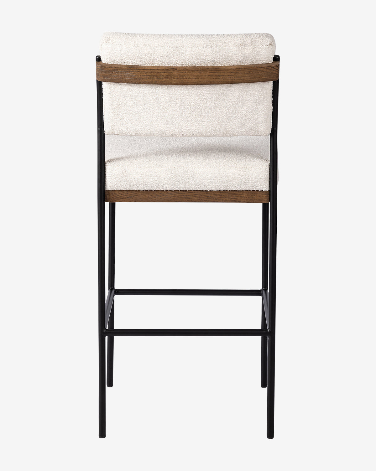 The Pascal Stool combines a black iron frame with an off-white cushioned seat and backrest, featuring wooden accents on the backrest’s top and bottom edges, as viewed from behind, by McGee & Co.