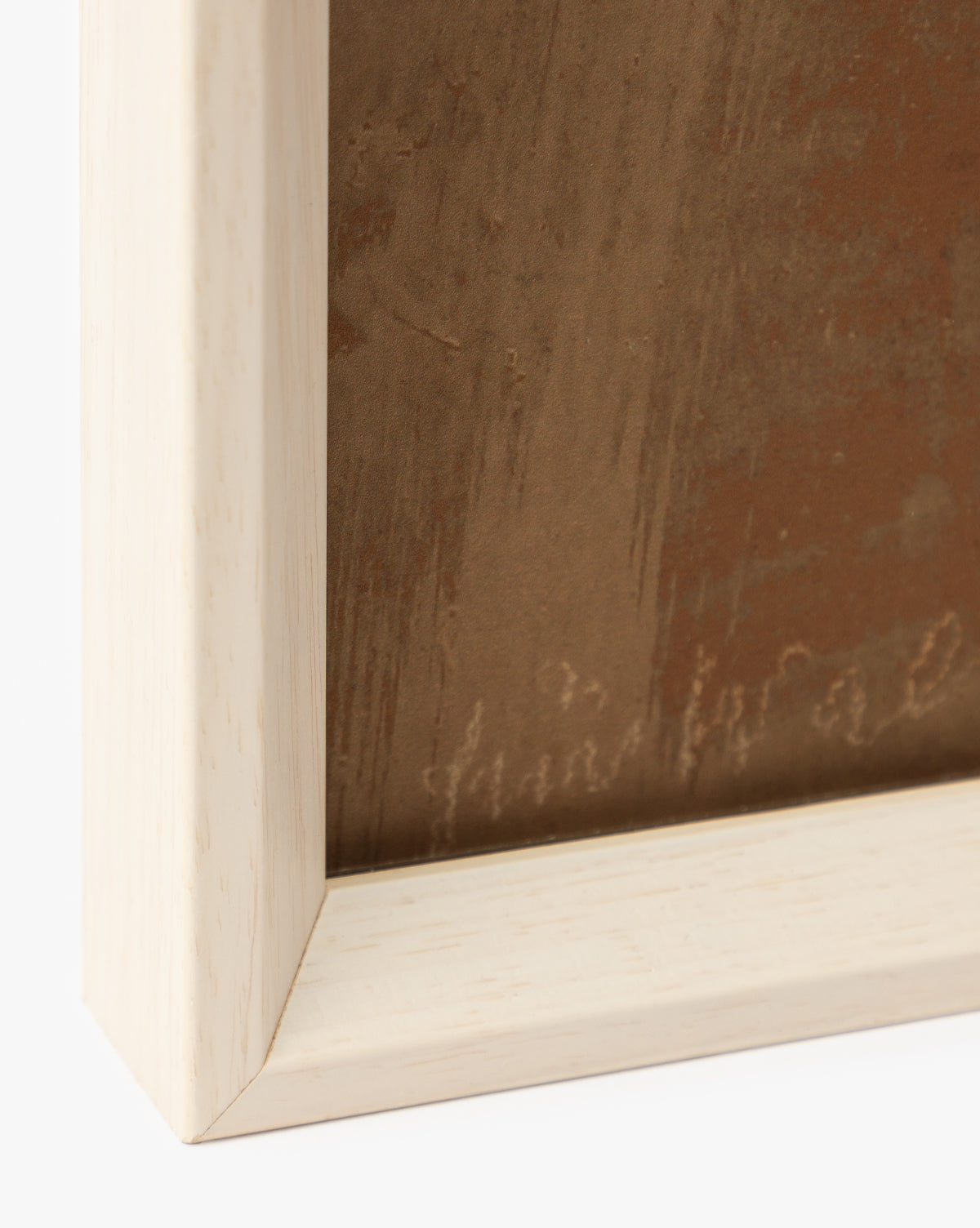 Close-up of the bottom left corner of a white wood frame with a light finish, featuring part of the Past Petals giclee prints textured brown artwork—an elegant, stylish home accent, by Vendixs