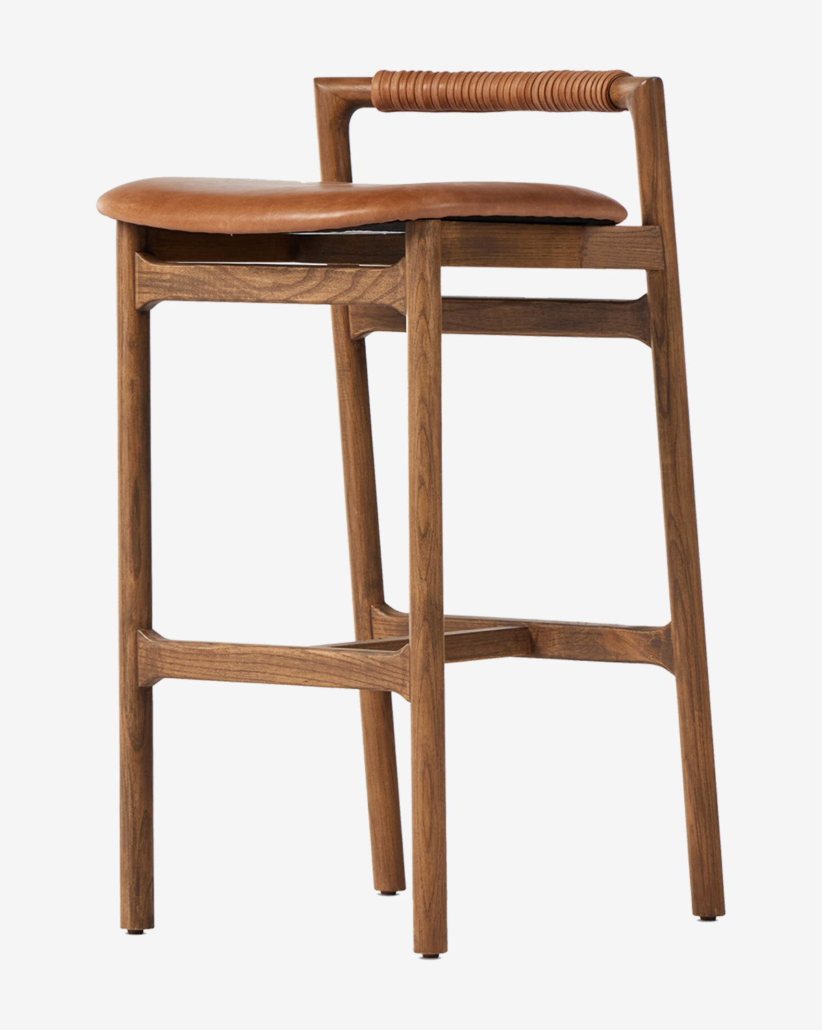The Patrin Stool by Four Hands showcases a modern ash wood frame, brown leather performance upholstery, a low wrapped backrest design, and four legs with support bars by Vendixs