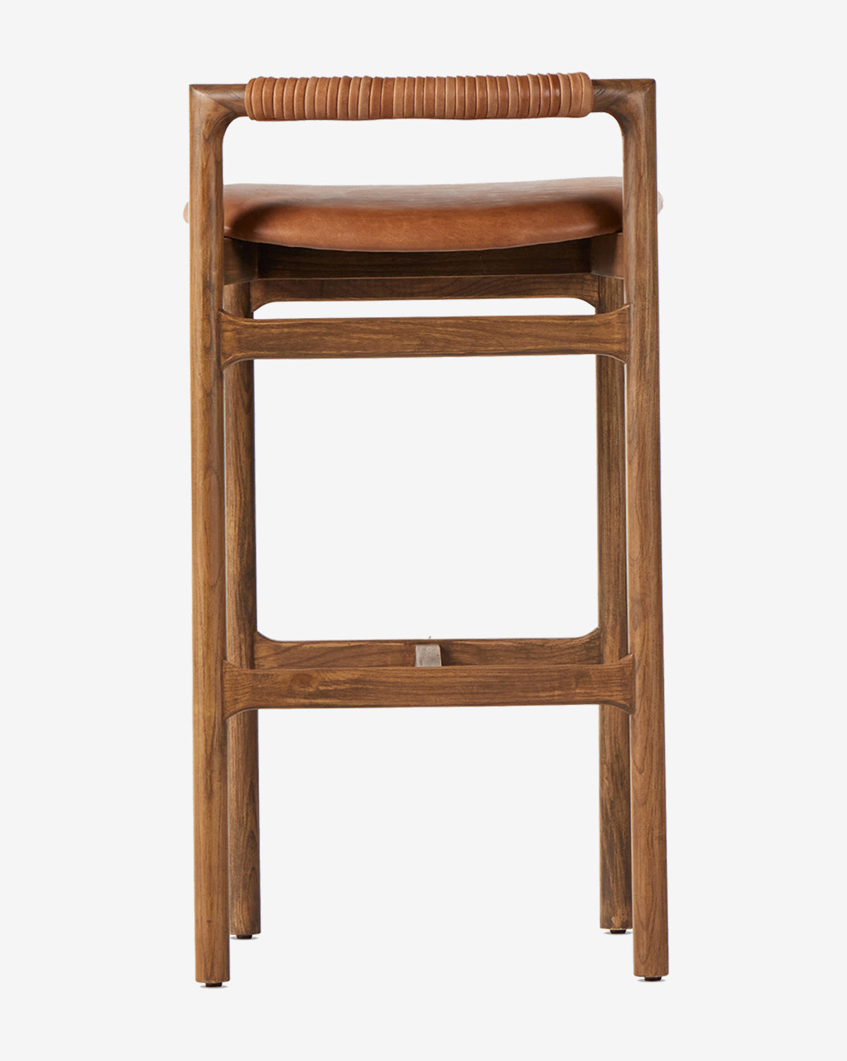 The Patrin Stool by Four Hands boasts a sturdy ash wood frame, leather-wrapped backrest, brown performance-upholstered seat, and a simple modern design with straight legs and a rectangular seat. Vendixs