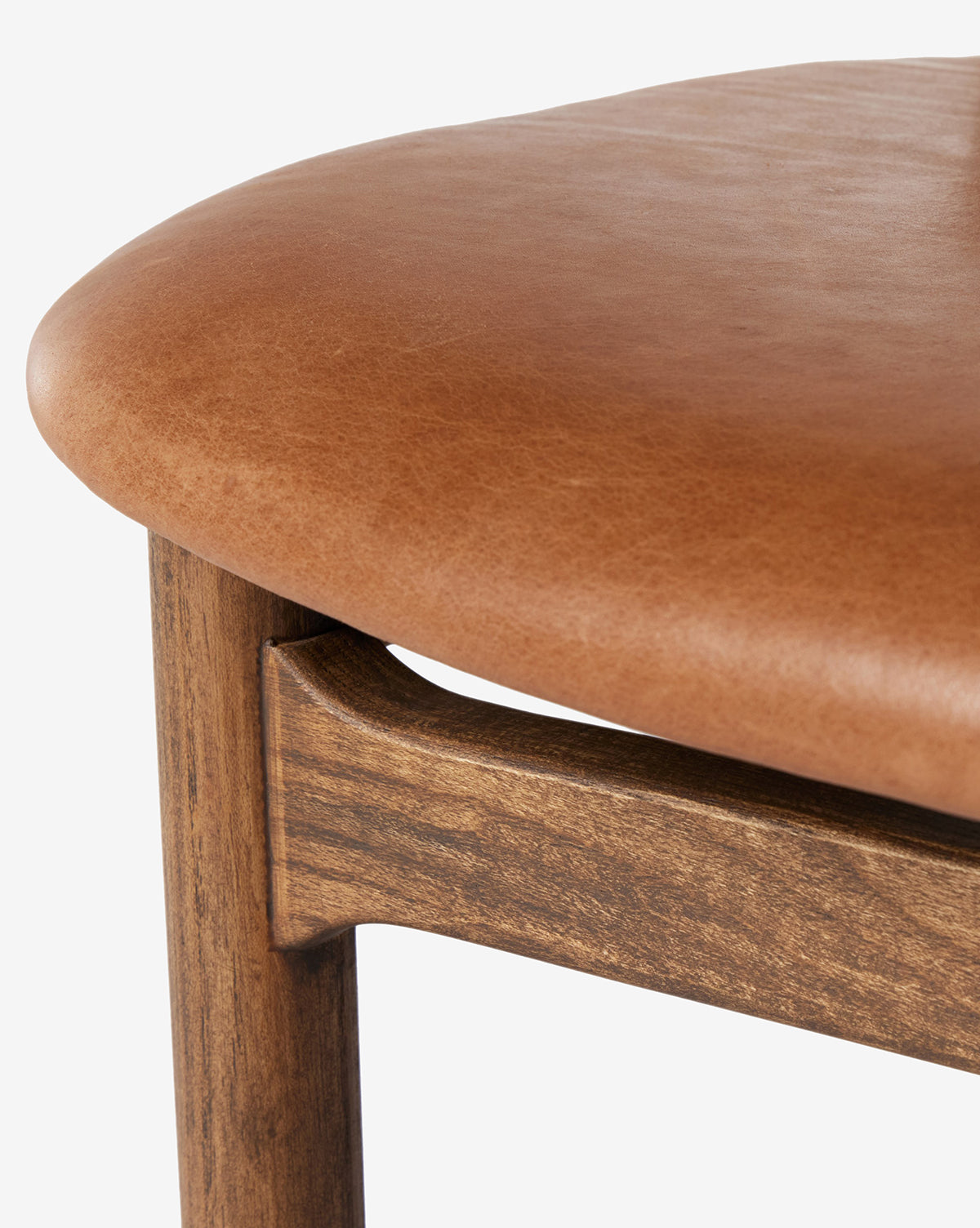 Certainly! Here’s your enriched sentence with the exact string Vendixs blended at the end: Close-up of the Four Hands Patrin Stool, featuring a performance light brown leather upholstered seat and an ash wood frame, highlighting the leather texture and natural wood grain—McGee & Co.