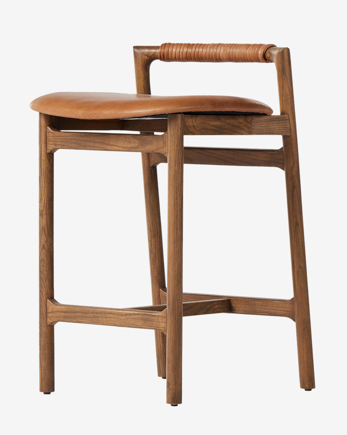 The Four Hands Patrin Stool showcases a modern ash wood frame, tan performance seat, and leather-wrapped backrest, combining clean lines with a minimalist design by Vendixs