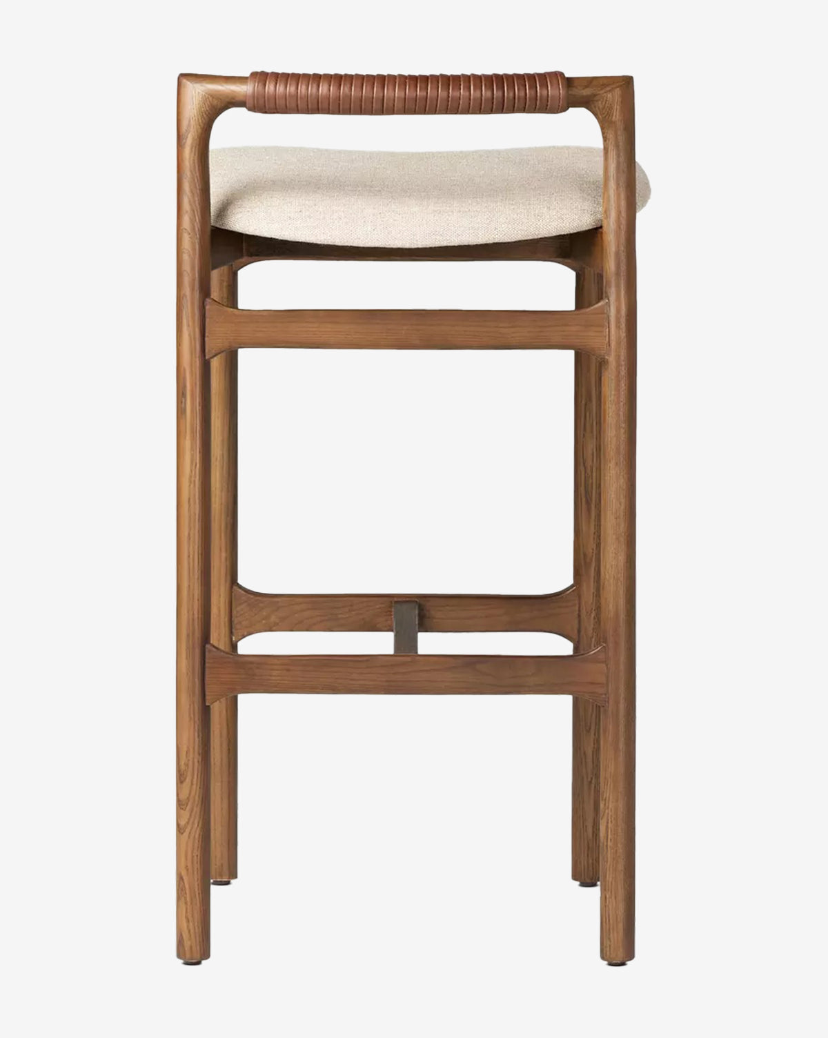 The Four Hands Patrin Stool features an ash wood frame, beige performance upholstery, and a wrapped leather backrest detail for a simple, modern look. Vendixs