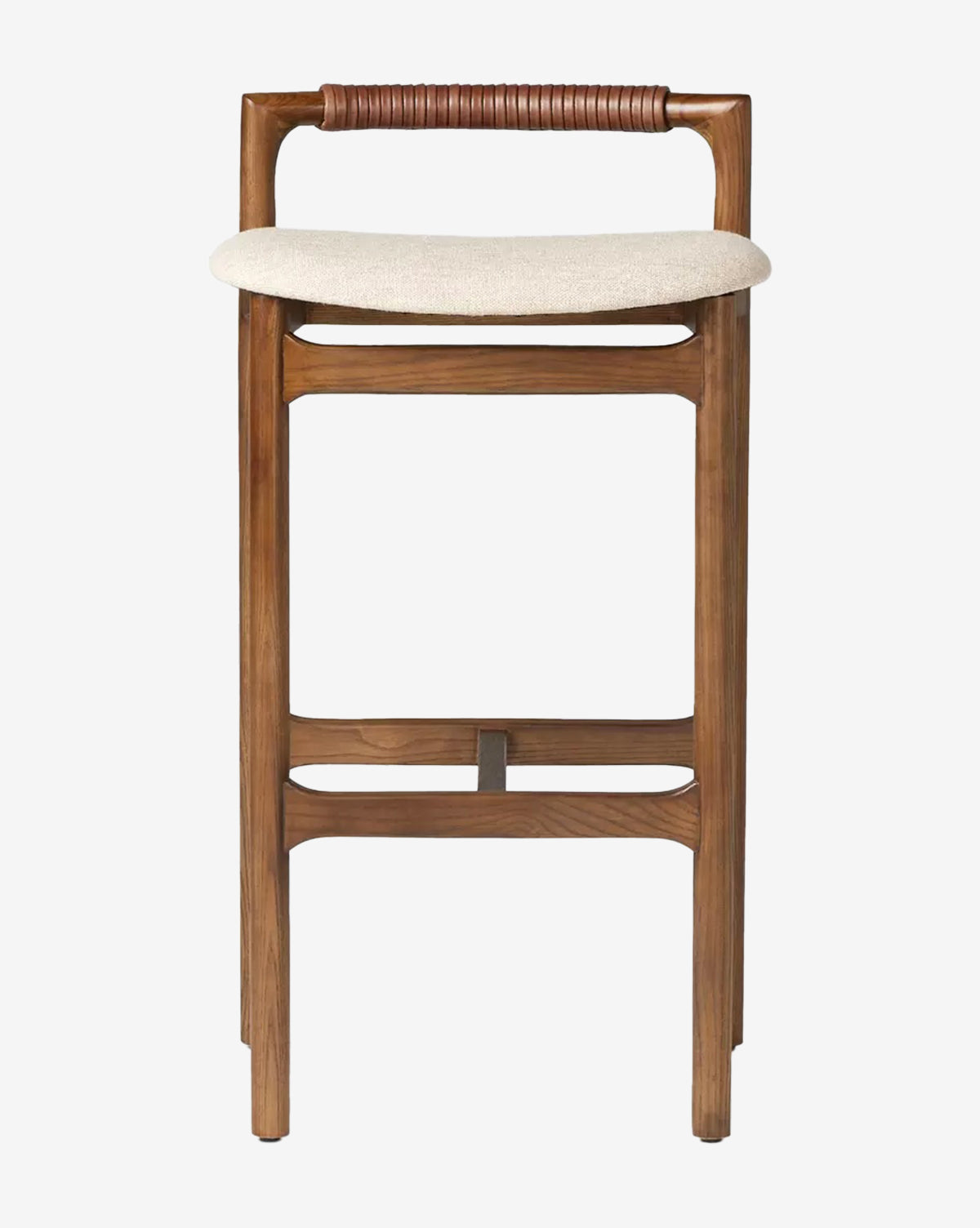 The Four Hands Patrin Stool boasts a modern ash wood frame, a light performance-upholstered seat, dark brown leather-wrapped rounded backrest, and straight wooden legs with footrests for minimalist style. Vendixs