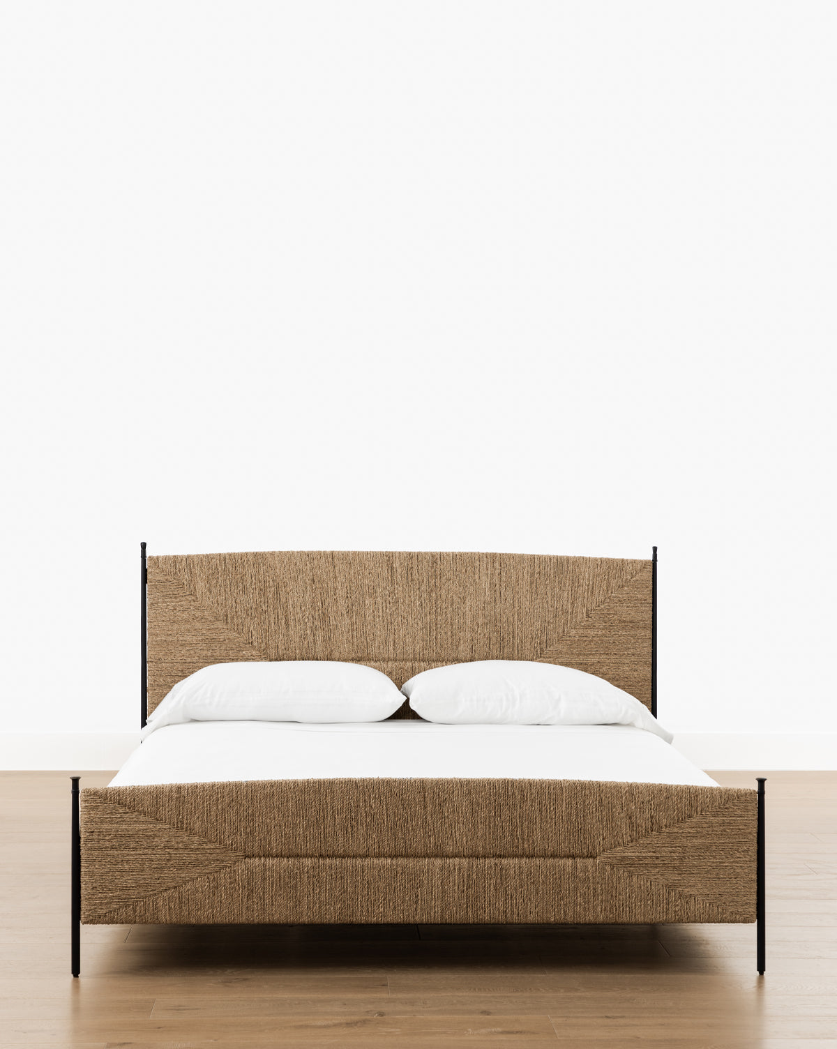 Vendixs metal bed frame with seagrass headboard and footboard.