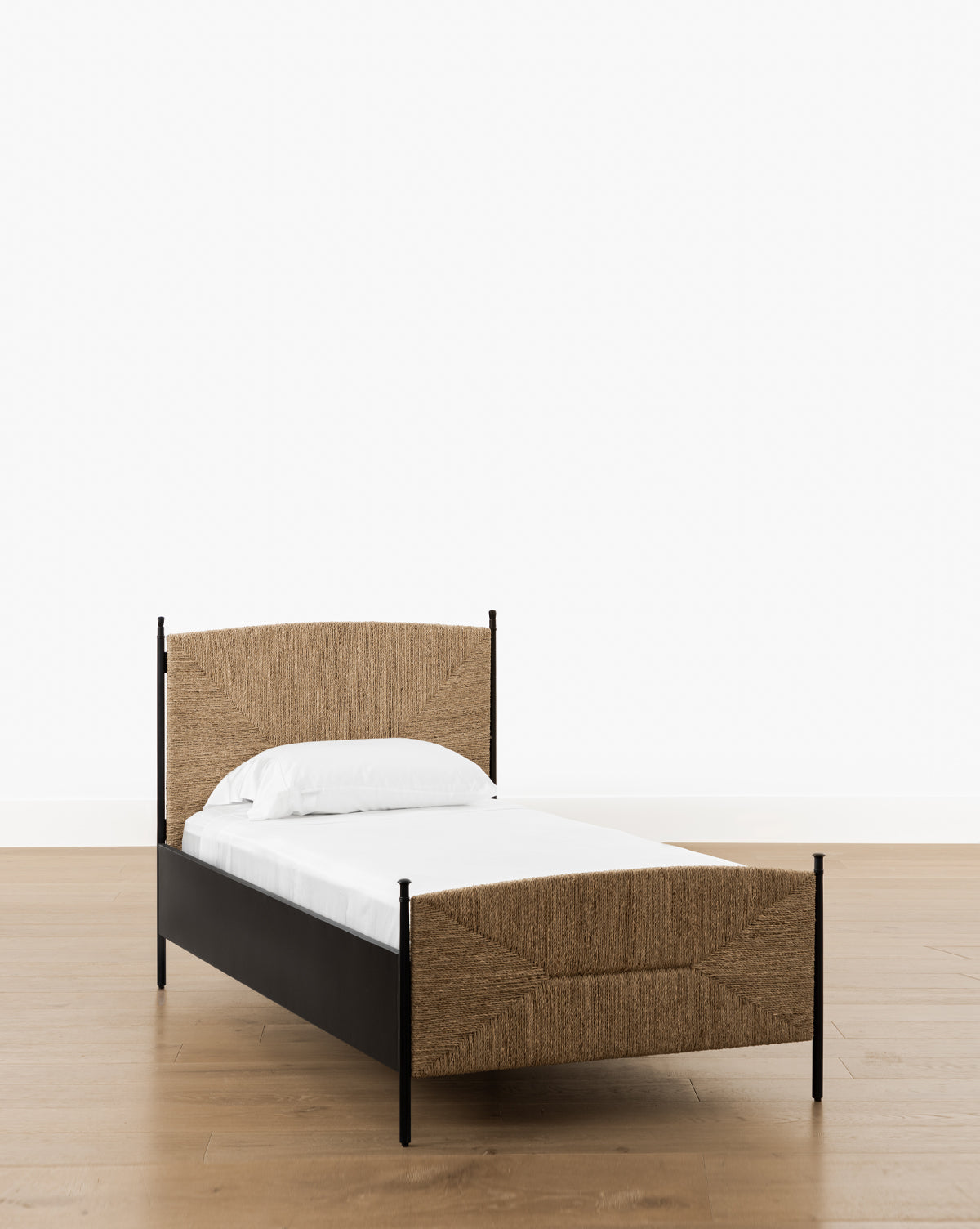 Vendixs metal bed frame with seagrass headboard and footboard. 