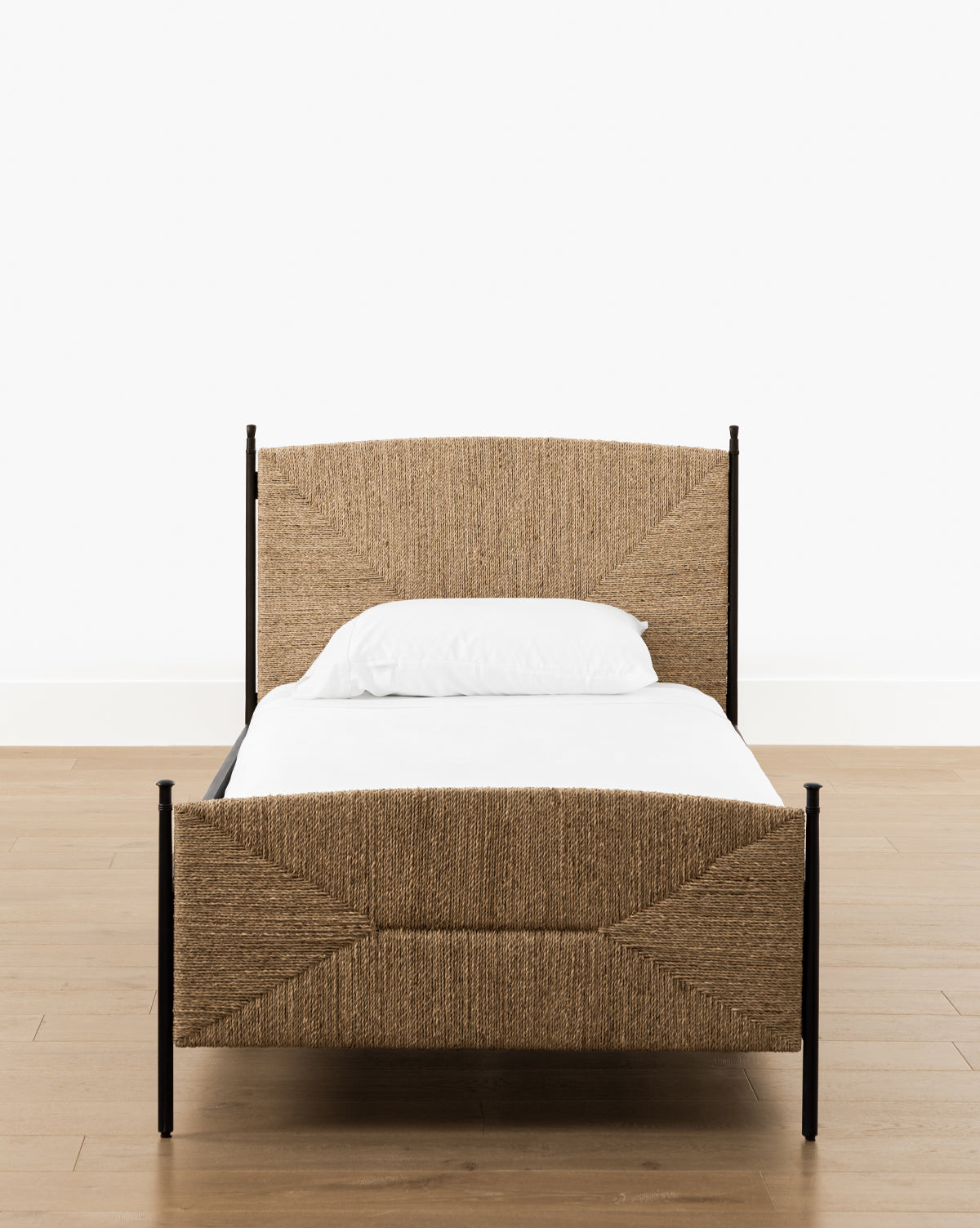 Vendixs metal bed frame with seagrass headboard and footboard.