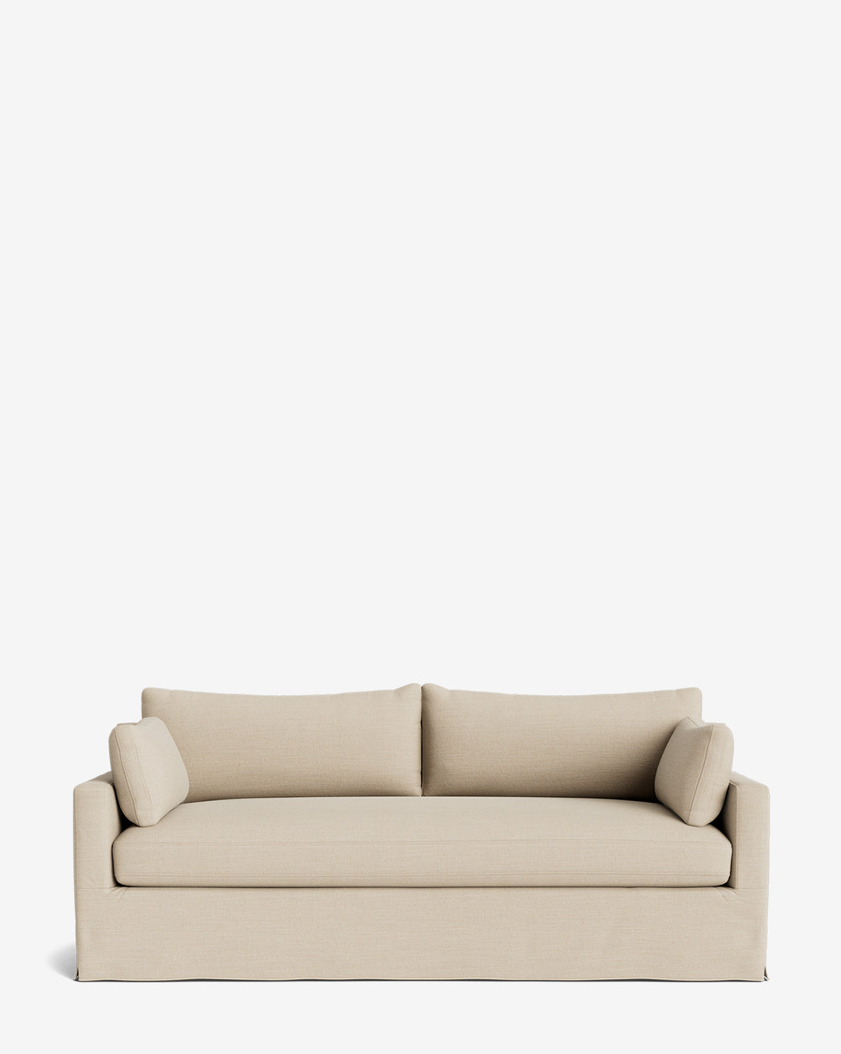 The Peterson Deep Slipcover Sofa (75-100) is a beige, modern handcrafted piece with feather blend cushions, two matching cylindrical bolster pillows, and clean straight lines, showcased against a plain white background by Vendixs