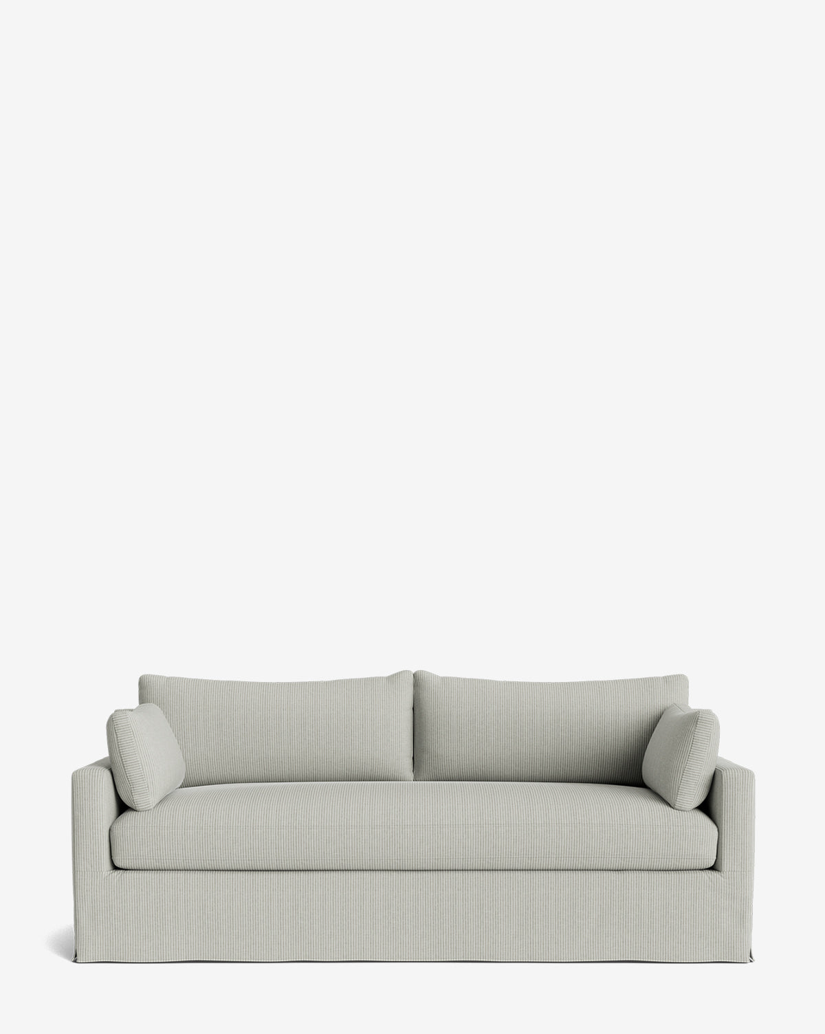 A modern light gray Peterson Classic Slipcover Sofa (75-100) with straight lines, feather blend cushions, and two cylindrical side pillows, set against a plain white background by Vendixs