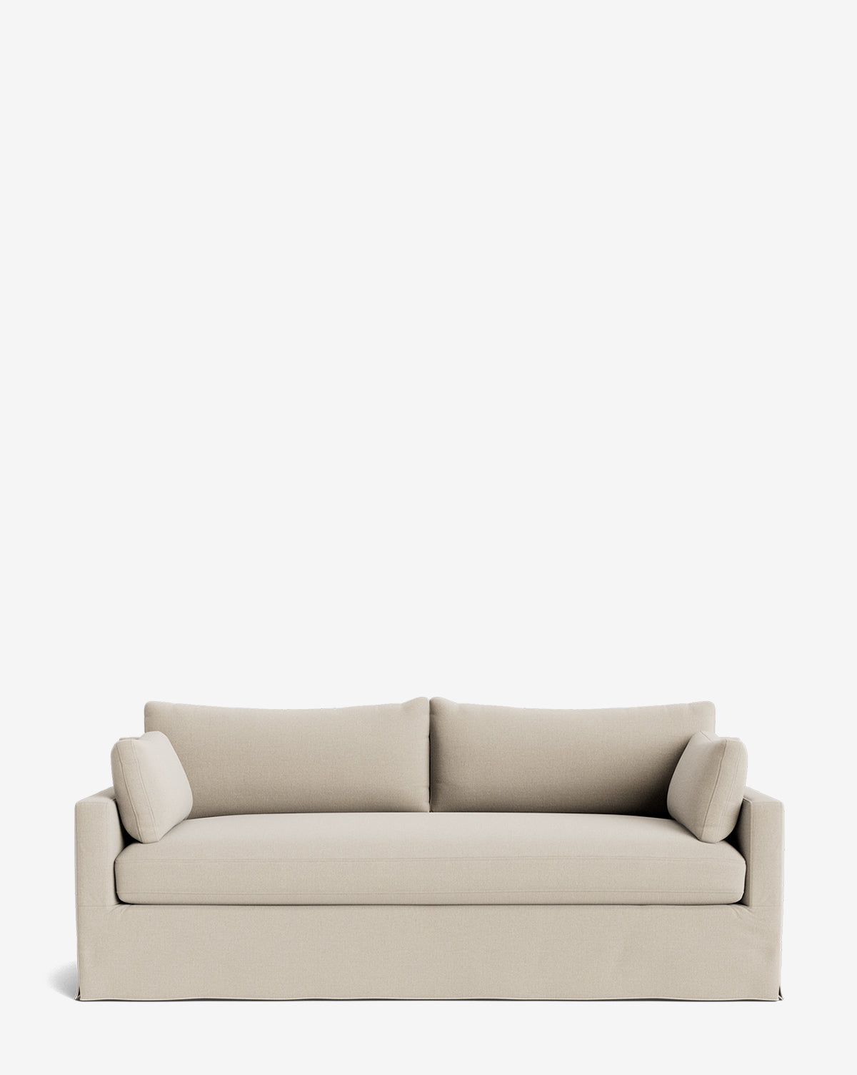 A Peterson Classic Slipcover Sofa (75-100) in modern beige, featuring clean lines, feather blend cushions, and two cylindrical bolster pillows, set against a plain white background by Vendixs