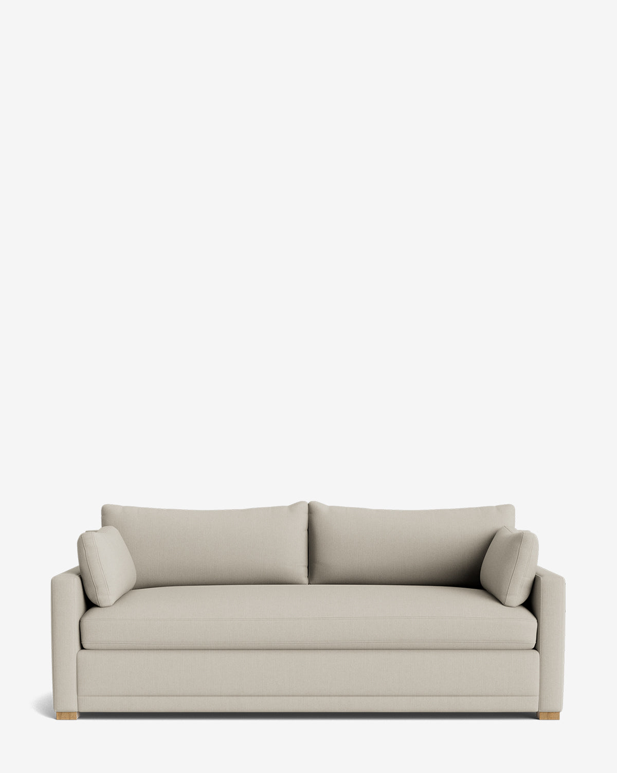 The Peterson Classic Upholstered Sofa (75 - 100) features modern light beige upholstery, straight arms, plush seat and back cushions, and two cylindrical bolster pillows, shown against a plain white background by Vendixs