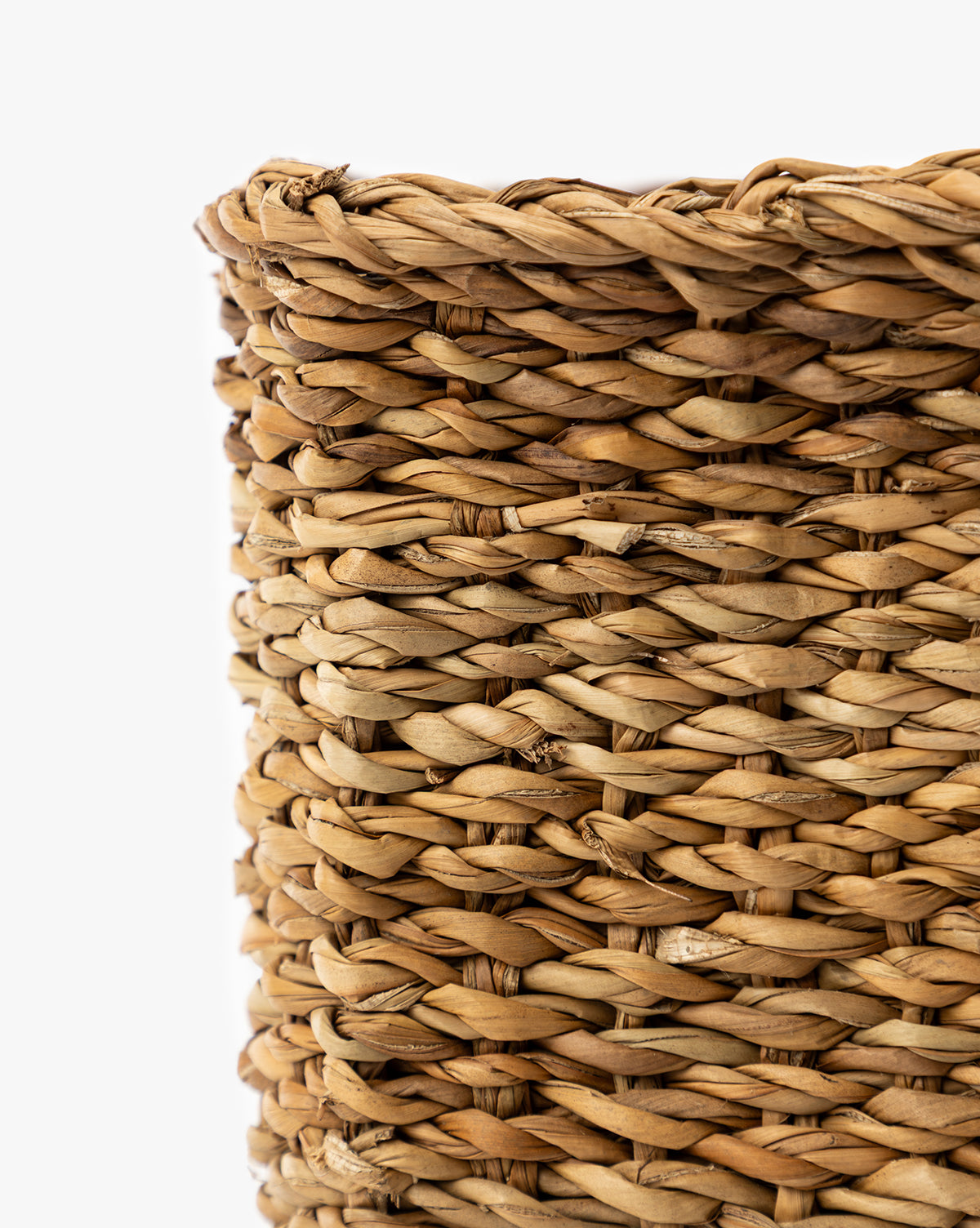 Close-up view of the Piers Baskets (Set of 3), highlighting the detailed texture and woven pattern of their natural fibers against a white background, by Vendixs