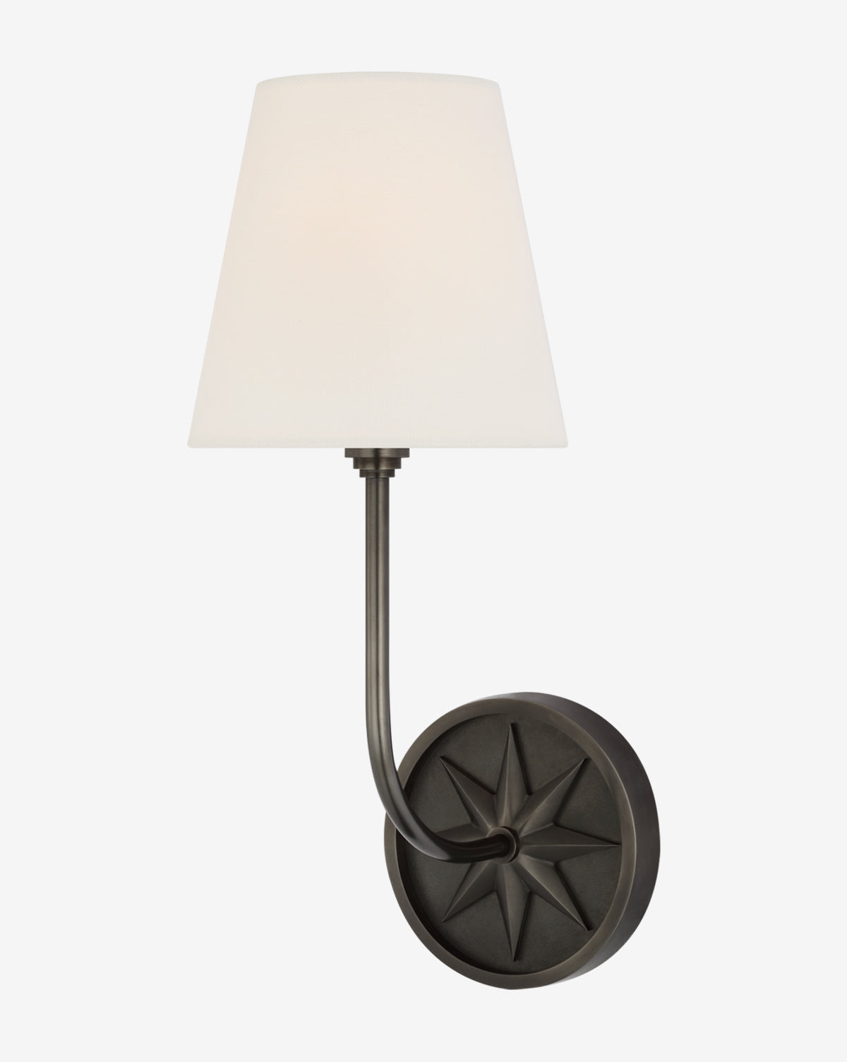 The Polaris Sconce by Visual Comfort & Co. Signature is a wall-mounted light with a black circular base featuring an embossed star, a curved metal arm, and a conical white linen shade, available at Vendixs