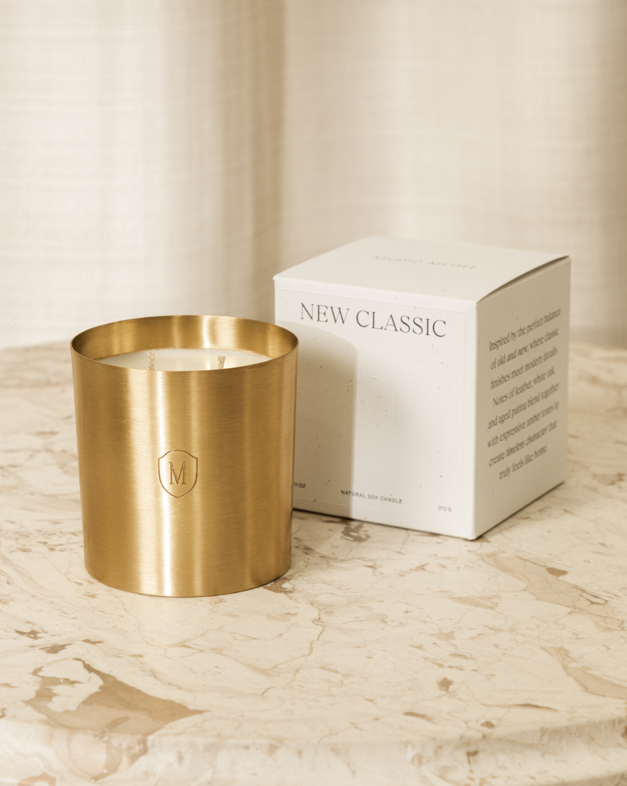 The subtle engraved logo adds artisan charm to this elegant candle display, by Vendixs
