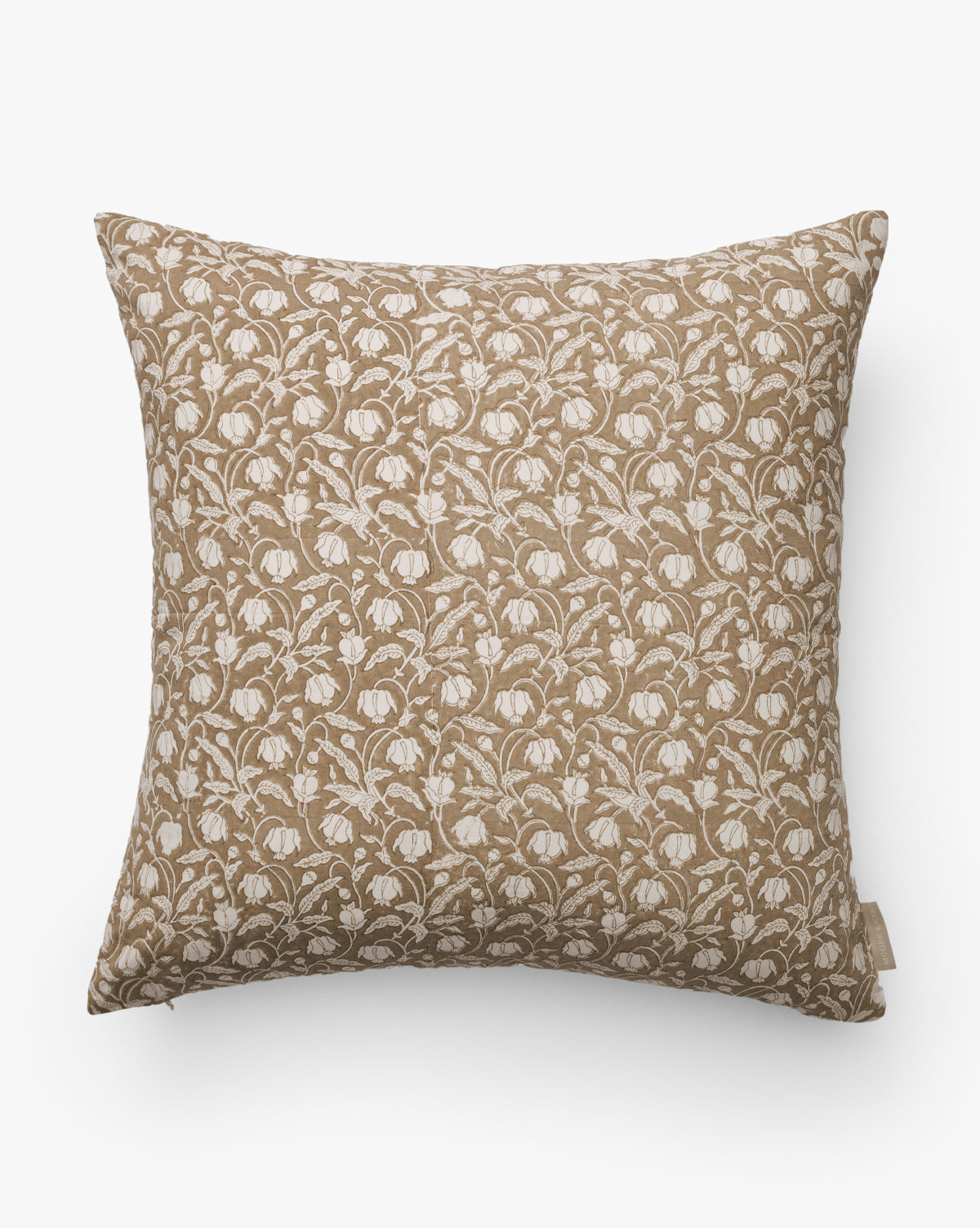 The Ravenna Block Print Pillow Cover features a light brown background with an all-over white, stylized floral pattern, shown here set against a plain white background, by McGee & Co.