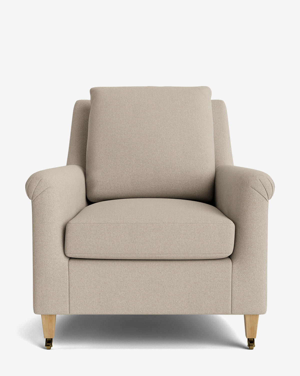 The Reedley Lounge Chair is a beige upholstered armchair featuring plush seat and back cushions, gently angled armrests, and wooden legs with brass caps, offering a luxurious lounge chair style by McGee & Co.