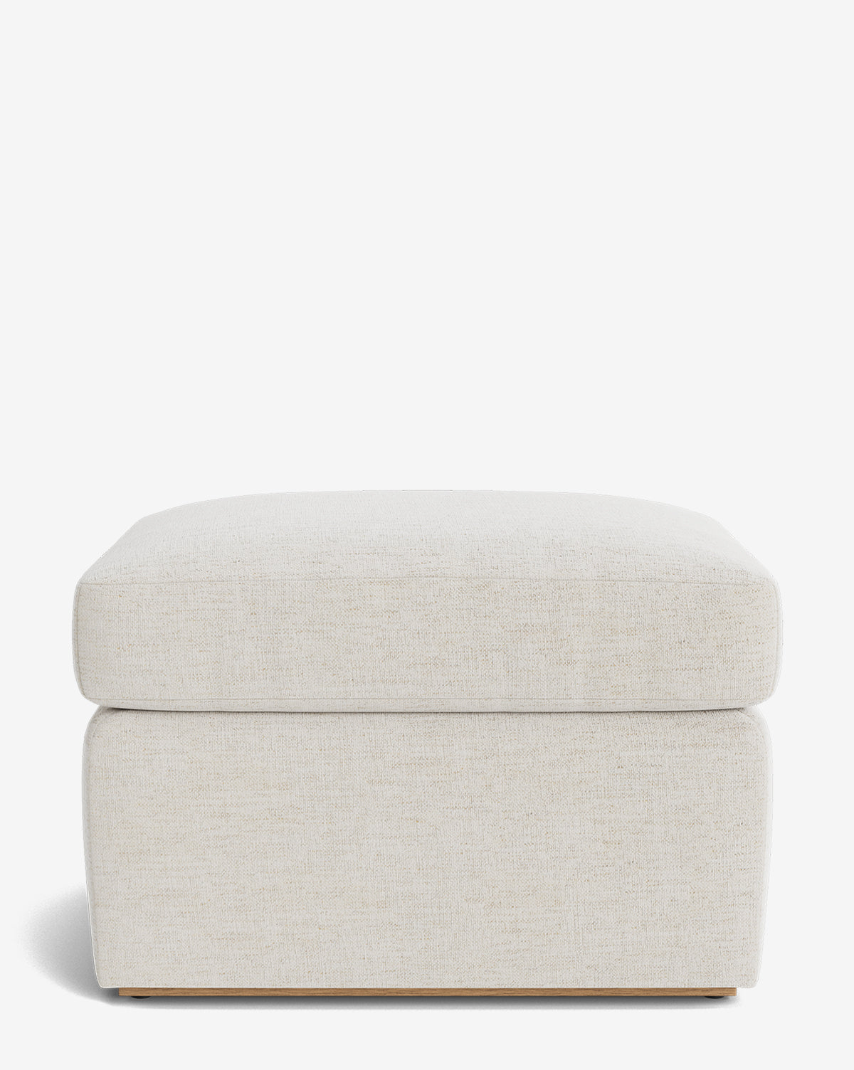 The Reese Ottoman is a handcrafted, square ottoman in light beige with a down-wrapped cushion and minimalist design, shown on a plain white background by McGee & Co.