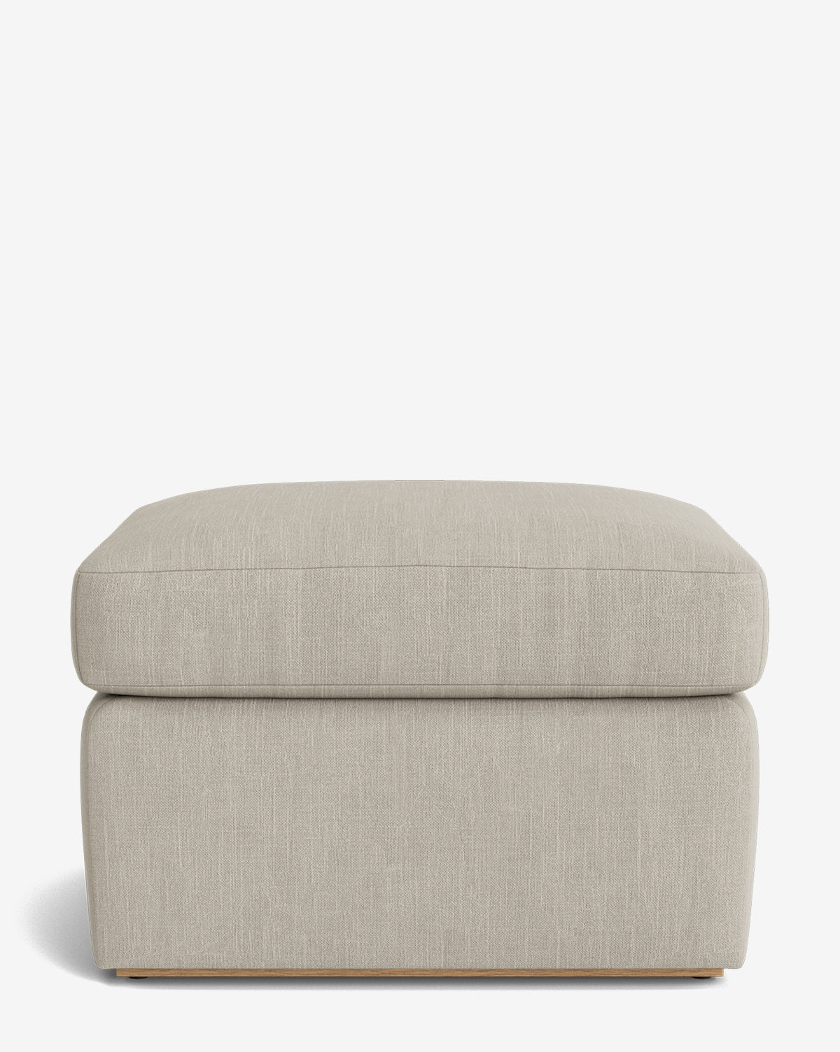 The Reese Ottoman is a square, handcrafted ottoman in light beige with a down-wrapped cushion top and modern design, displayed on a plain white background by Vendixs