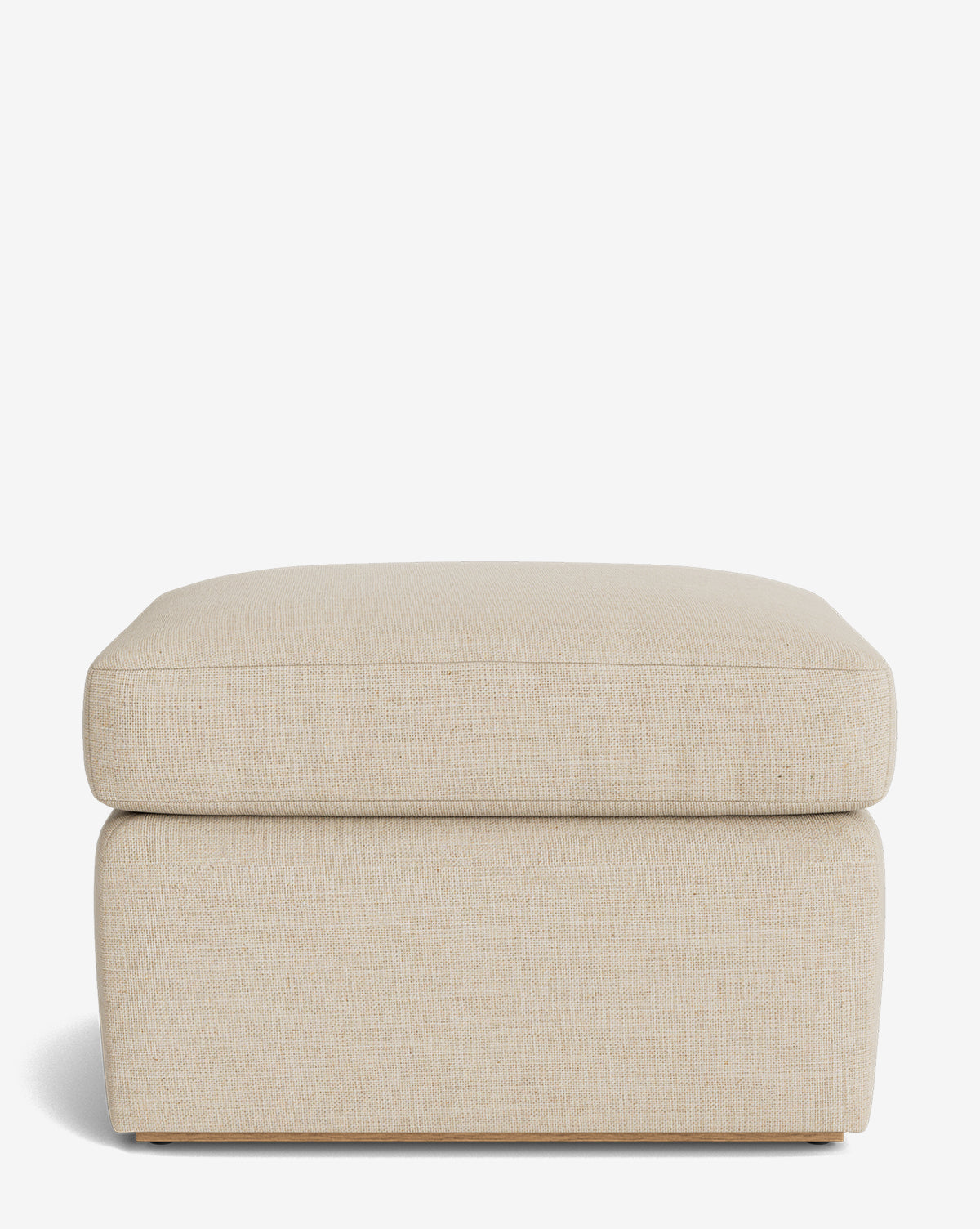 The Reese Ottoman is a handcrafted rectangular ottoman in beige, featuring clean lines and a plush down-wrapped cushion top, shown on a plain white background, by McGee & Co.