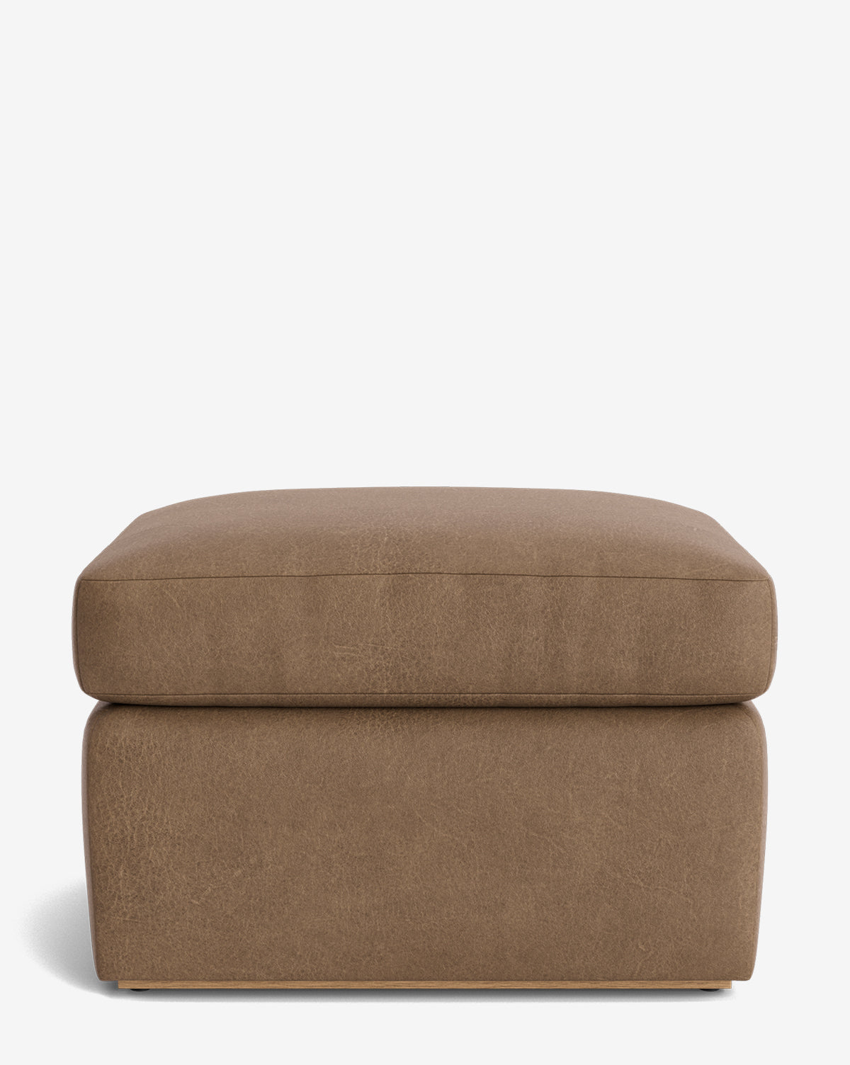 The Reese Ottoman is a square, handcrafted brown ottoman with a cushioned down-wrapped top and a modern design, displayed against a plain white background, by McGee & Co.