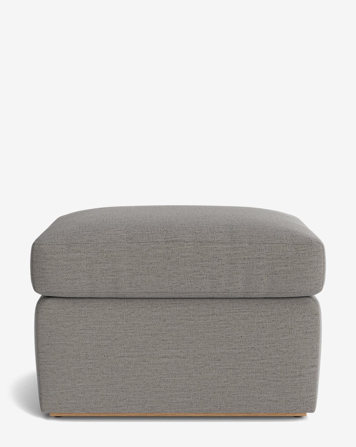 The Reese Ottoman is a modern, rectangular piece handcrafted with light gray upholstery and a plush down-wrapped cushion, showcasing a minimalist design against a plain white background, by McGee & Co.