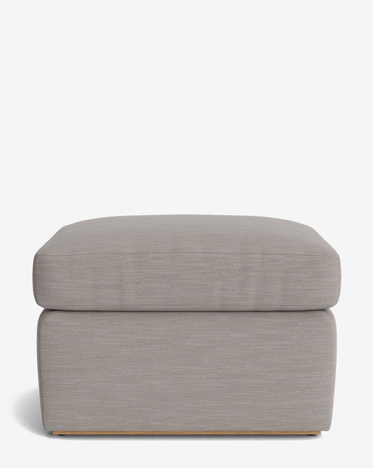 The Reese Ottoman is a modern piece upholstered in light grey fabric with a down-wrapped cushion and solid base, shown against a plain white background, by McGee & Co.