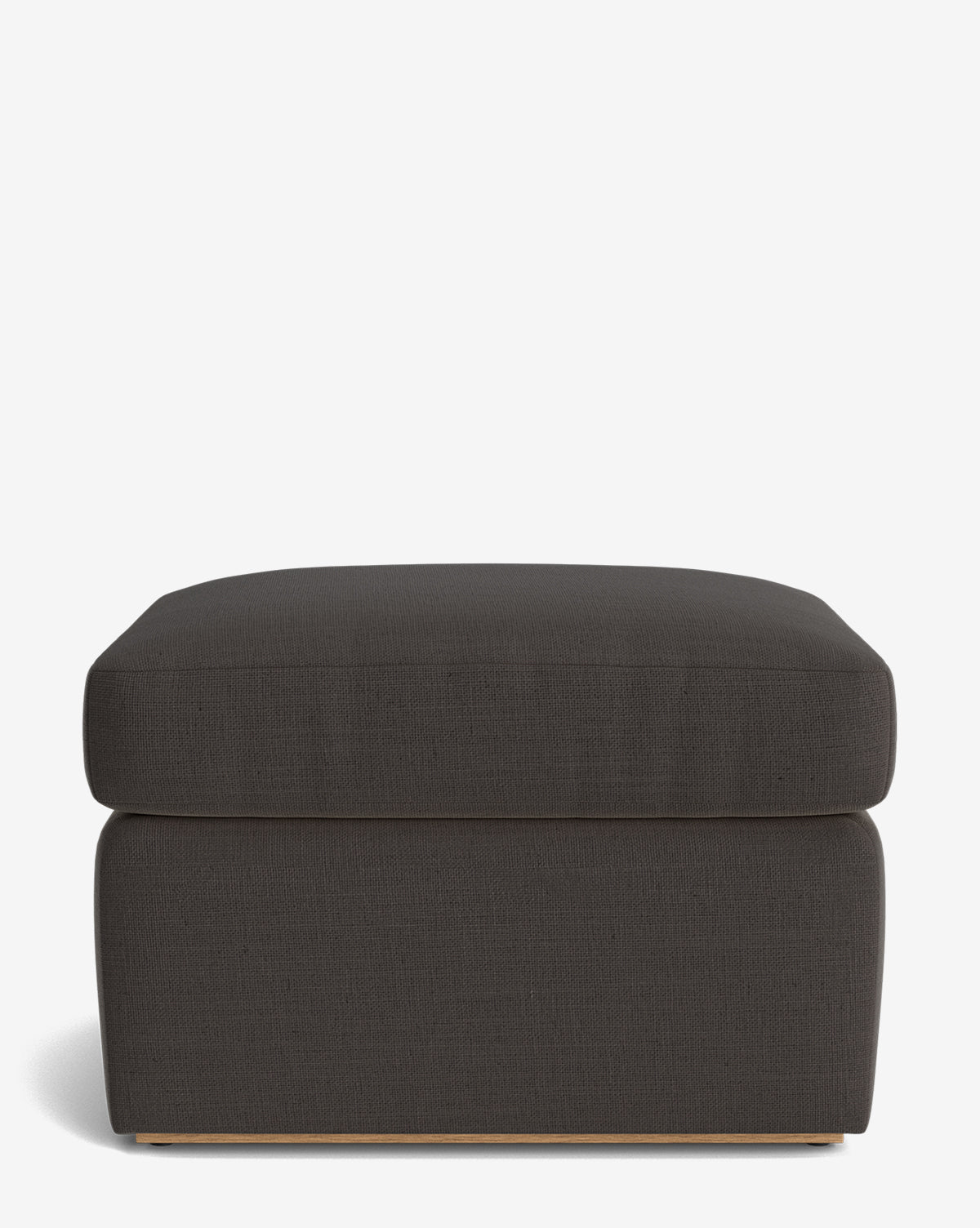 The Reese Ottoman features a modern square design, dark gray upholstery, a down-wrapped cushion, and a minimalistic wooden base, presented on a plain white background by McGee & Co.