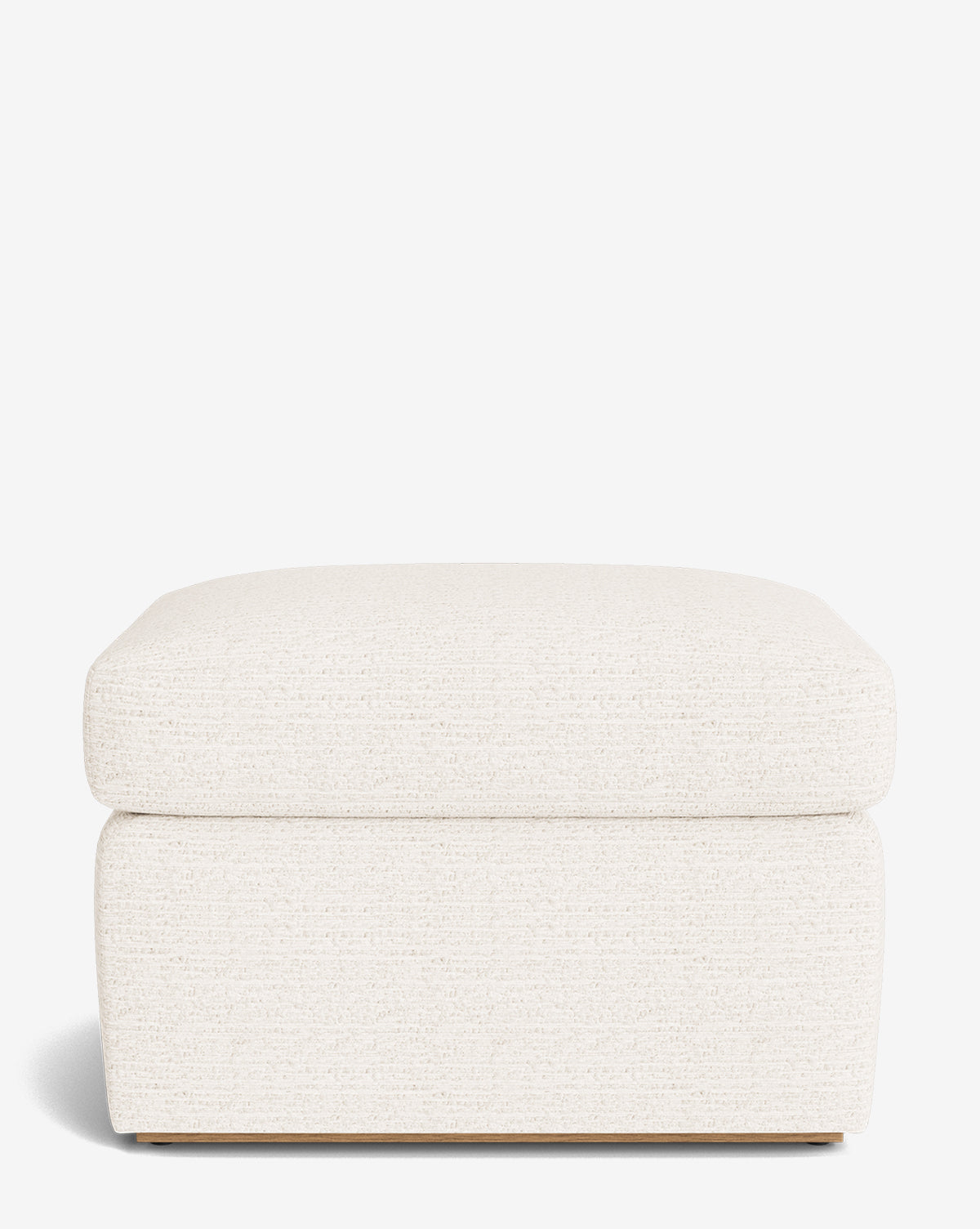The Reese Ottoman is a handcrafted, rectangular piece with a plush down-wrapped cushion and off-white textured upholstery, shown from the front against a plain white background. Its simple modern design adds comfort and style to any space by McGee & Co.