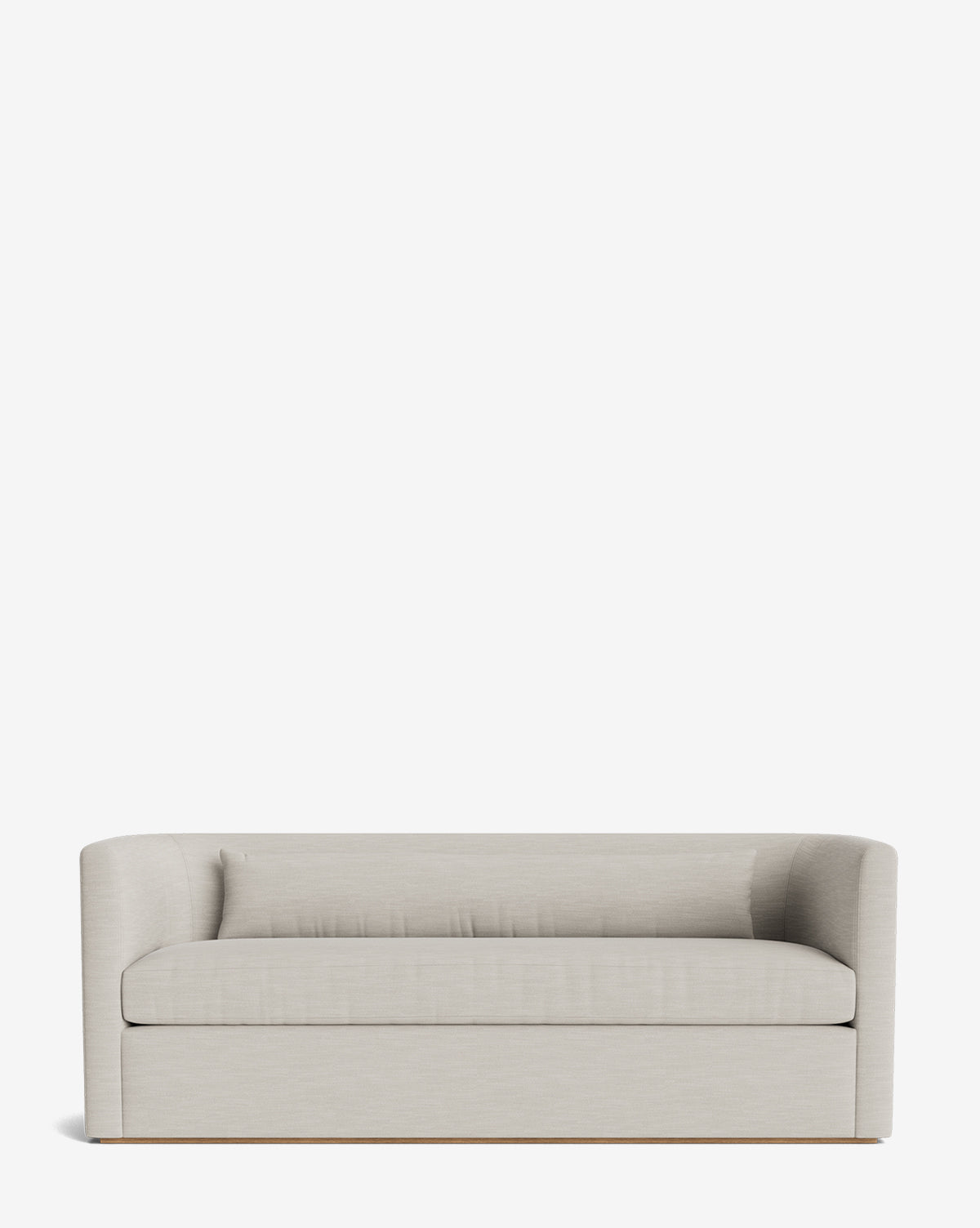 The Reese Sofa (84-96) features down-wrapped cushions, a modern light gray design with low curved arms, and a simple boxy handcrafted alder wood base, shown against a plain white background by McGee & Co.