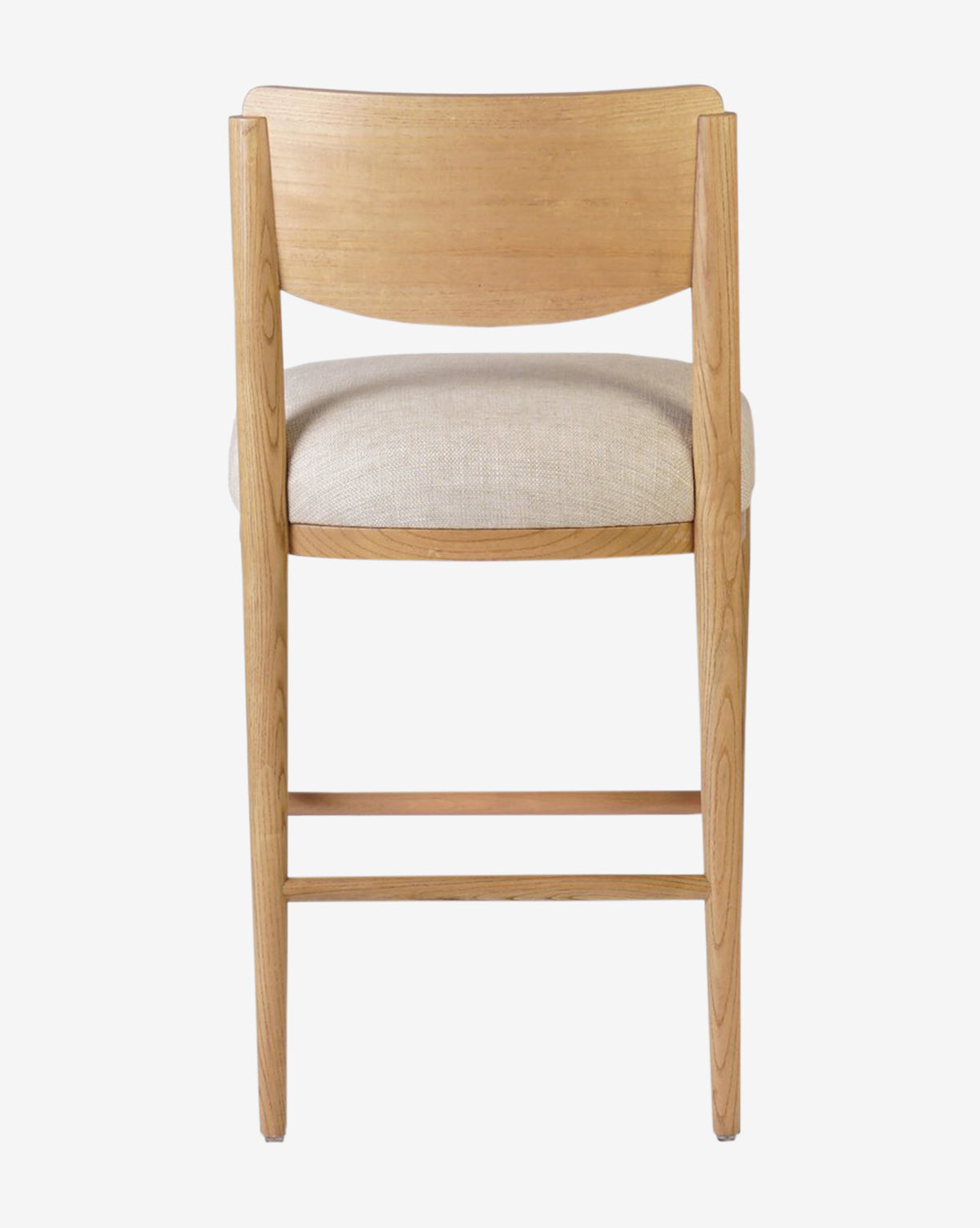 The Reverie Stool by Four Hands is a natural wood bar stool featuring a curved backrest and light beige upholstered seat, shown from behind against a plain white background—an ideal stylish addition to any kitchen. Vendixs