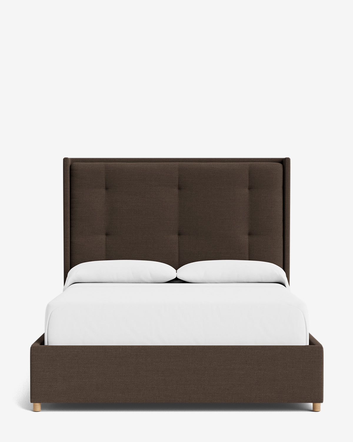 The Ria Bed is a modern upholstered bed with a dark brown frame and tall, tufted headboard. Shown with white bedding and two pillows against a plain white background, this piece is customizable to suit your style by Vendixs