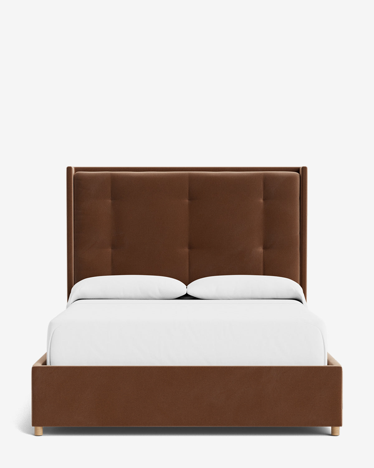 The Ria Bed is a modern, customizable brown upholstered bed featuring a tall tufted headboard, white bedding, and two white pillows, displayed against a plain white background by Vendixs
