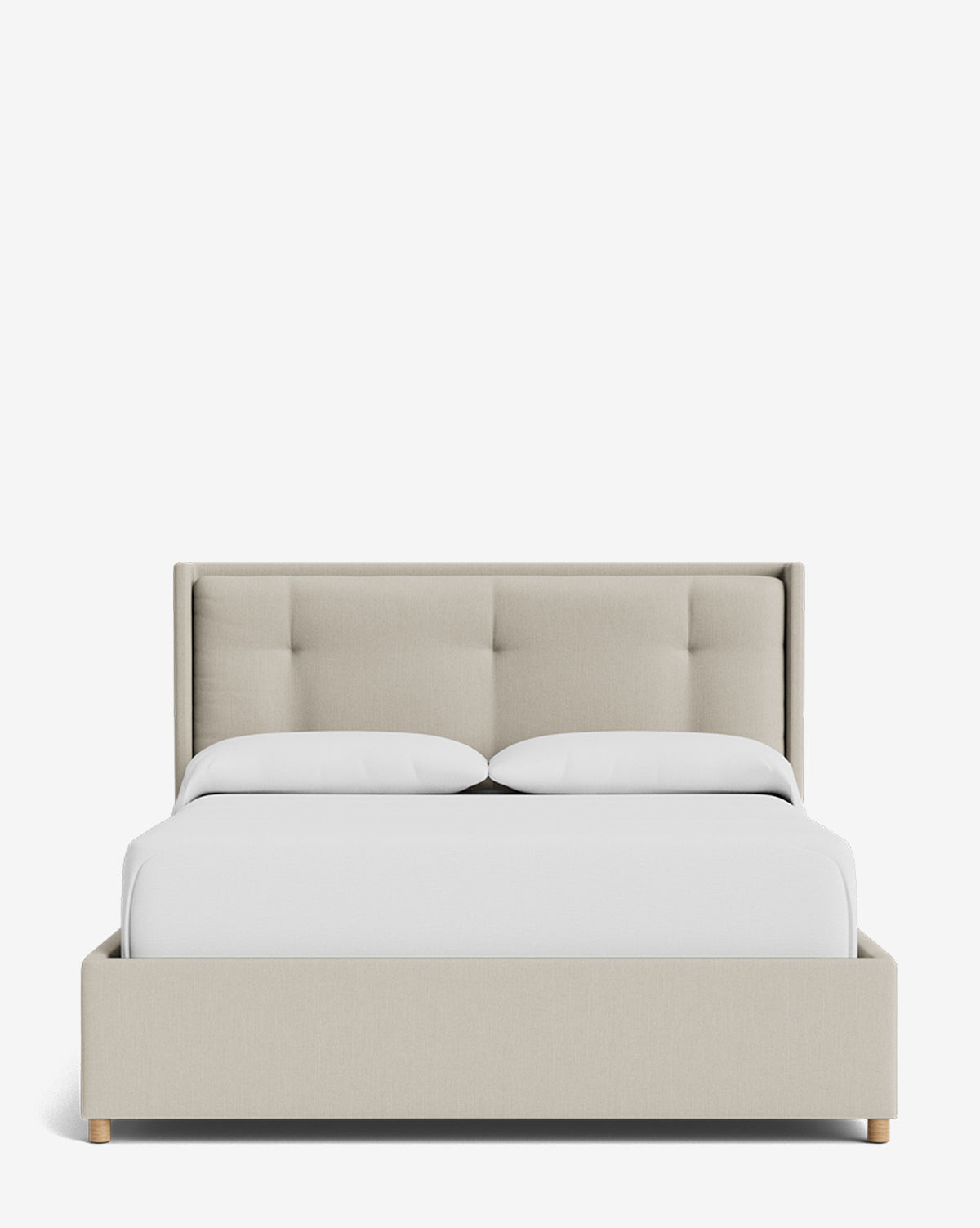 The Ria Bed Low Headboard is a modern beige upholstered bed with a tufted headboard and light wood legs, neatly styled with white bedding and set against a plain white background, by Vendixs