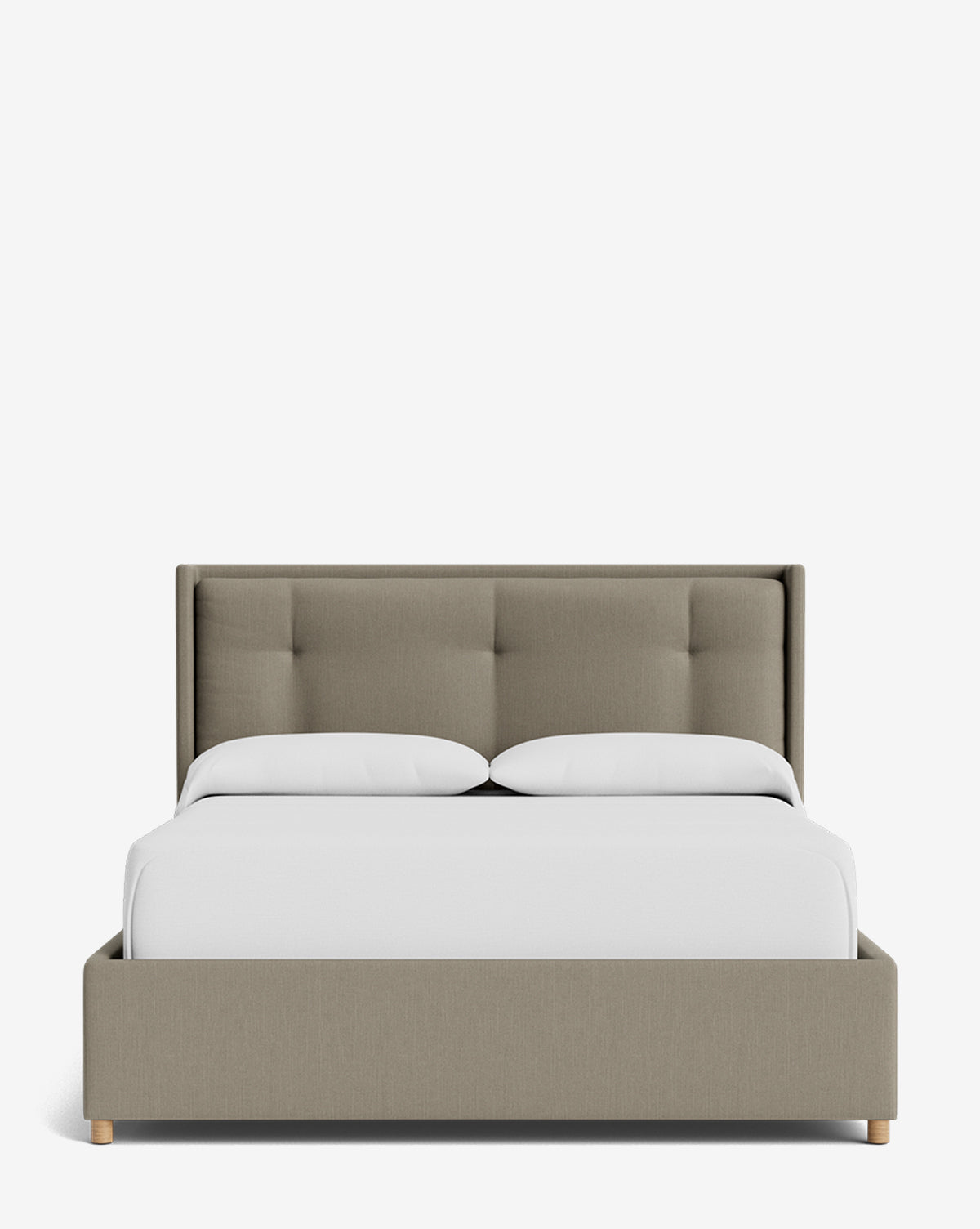 The Ria Bed Low Headboard showcases a light brown upholstered frame with a tufted headboard, dressed in white bedding and two pillows, set against a plain white background by Vendixs