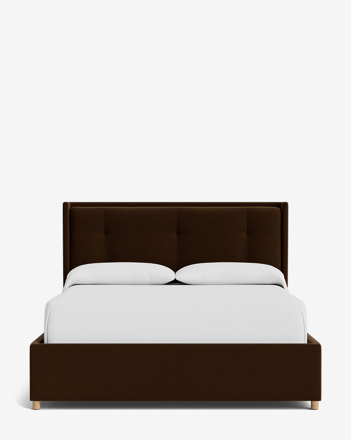 The Ria Bed Low Headboard, a modern dark brown upholstered bed with a tufted headboard, is displayed from the front with white bedding and two pillows against a plain white background by Vendixs