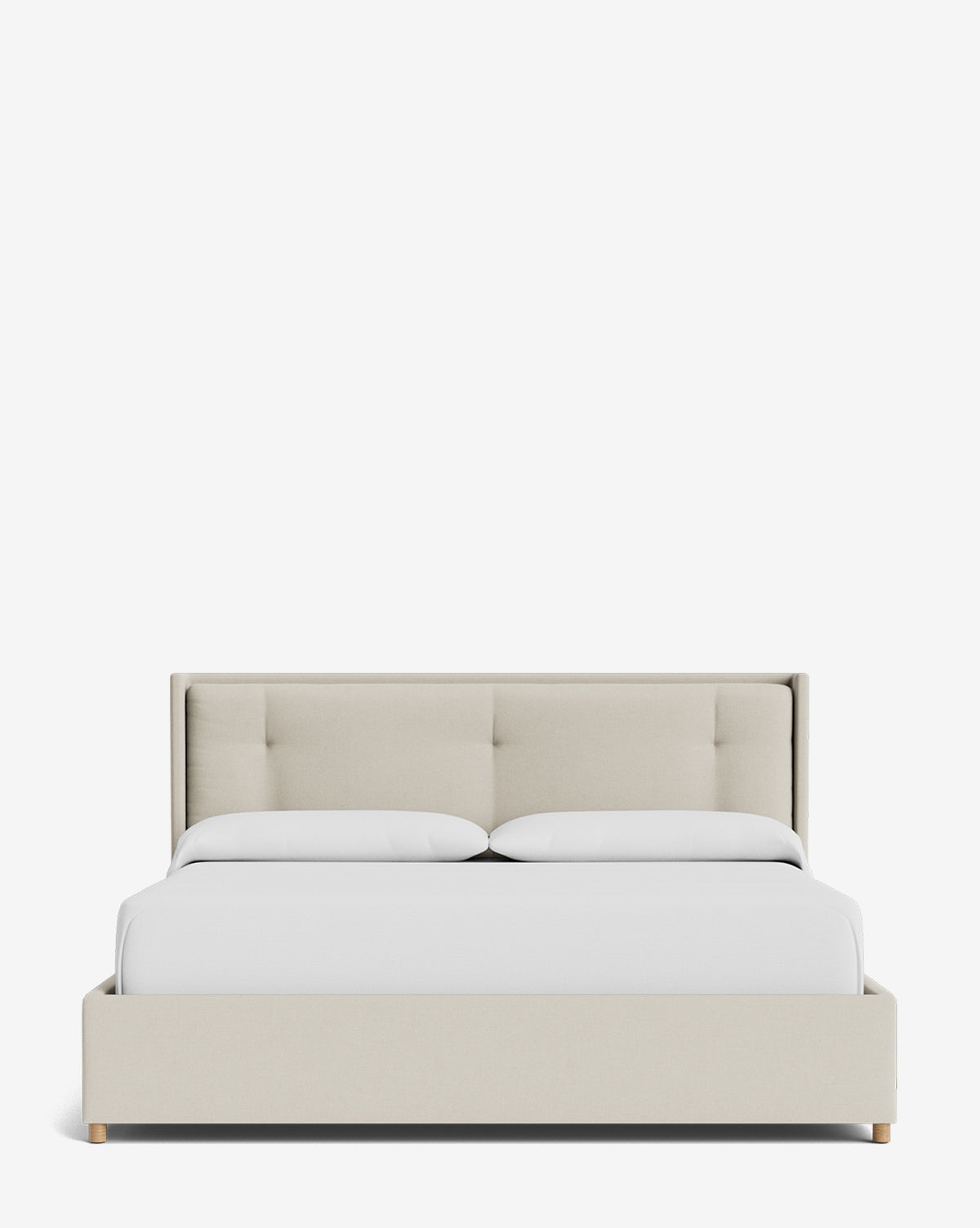 The Ria Bed Low Headboard features a modern beige tufted headboard and frame, styled with two white pillows and a neatly made white comforter, set against a plain white background, by Vendixs