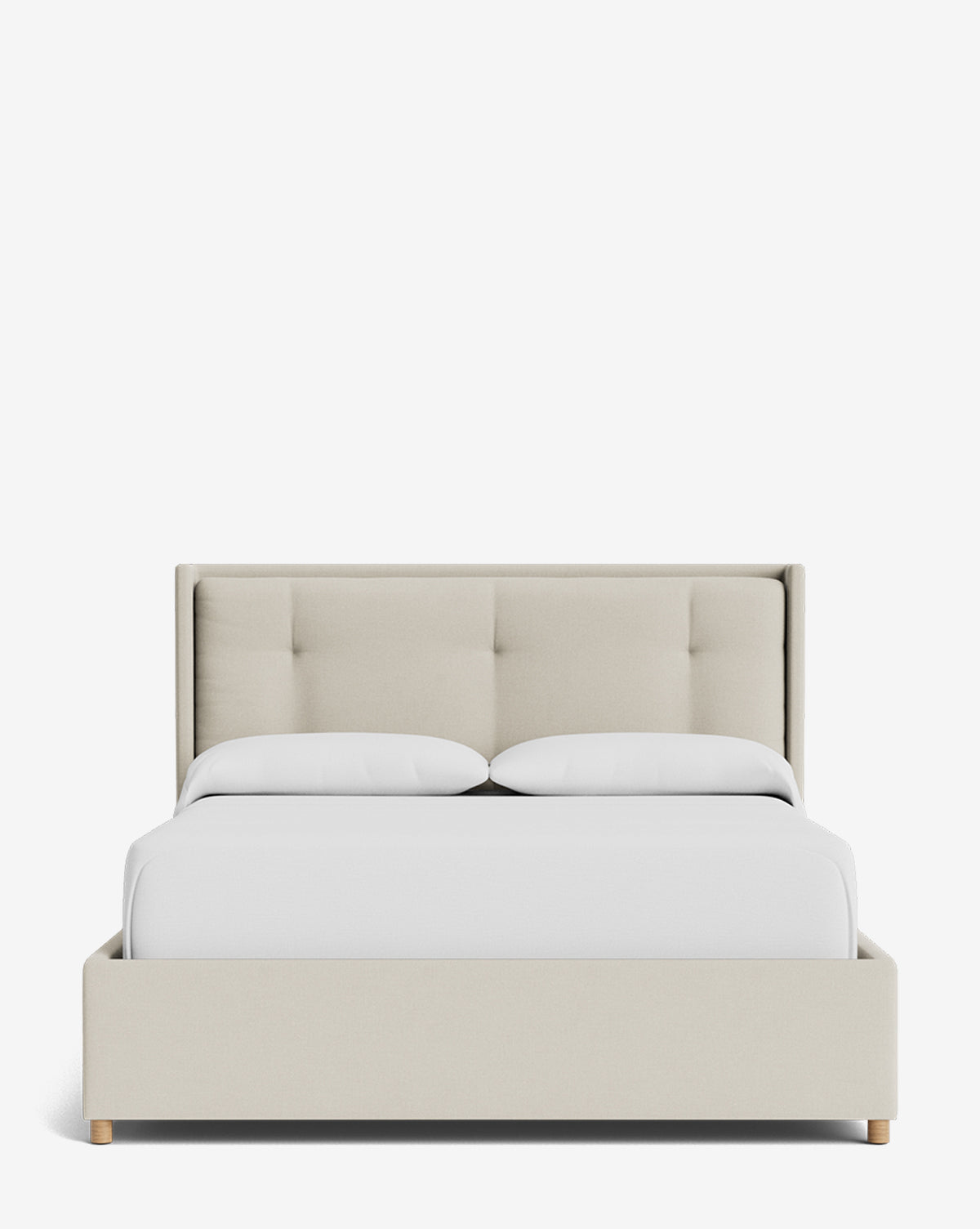 The Ria Bed Low Headboard is a modern upholstered bed with a light beige fabric frame, tufted headboard, white bedding, and light wooden legs, shown on a plain white background by Vendixs